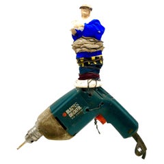 Not Disturbing, Assemblage with Old Drill and Ceramic Figurine