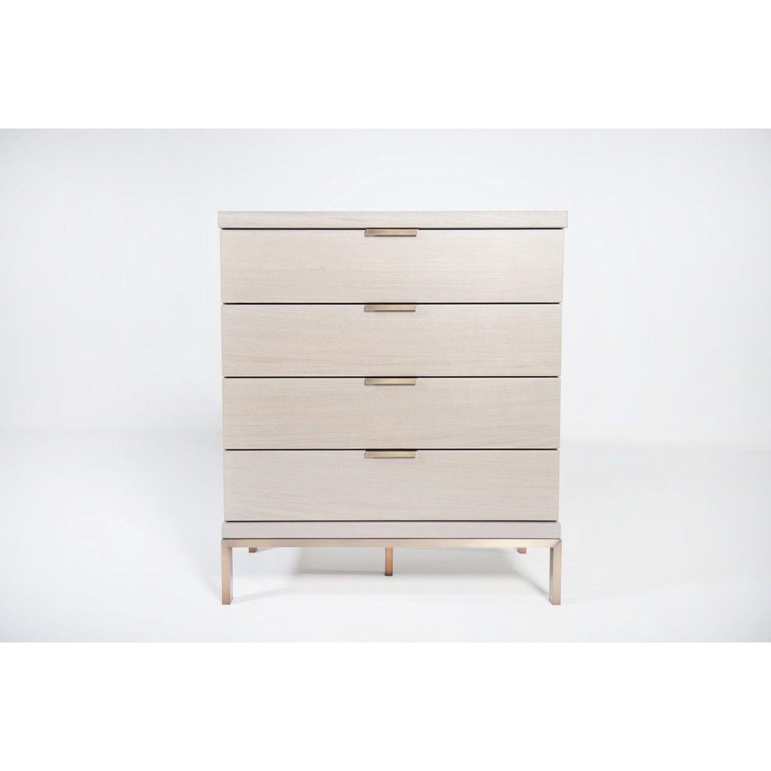 Nota Bene oak commode by Van Rossum
Dimensions: D81 x W49 x H92 cm
Materials: Oak, brass.

The wood is available in all standard Van Rossum colors, or in a matching finish to customer's own sample.
Detailing is available in stainless steel;
