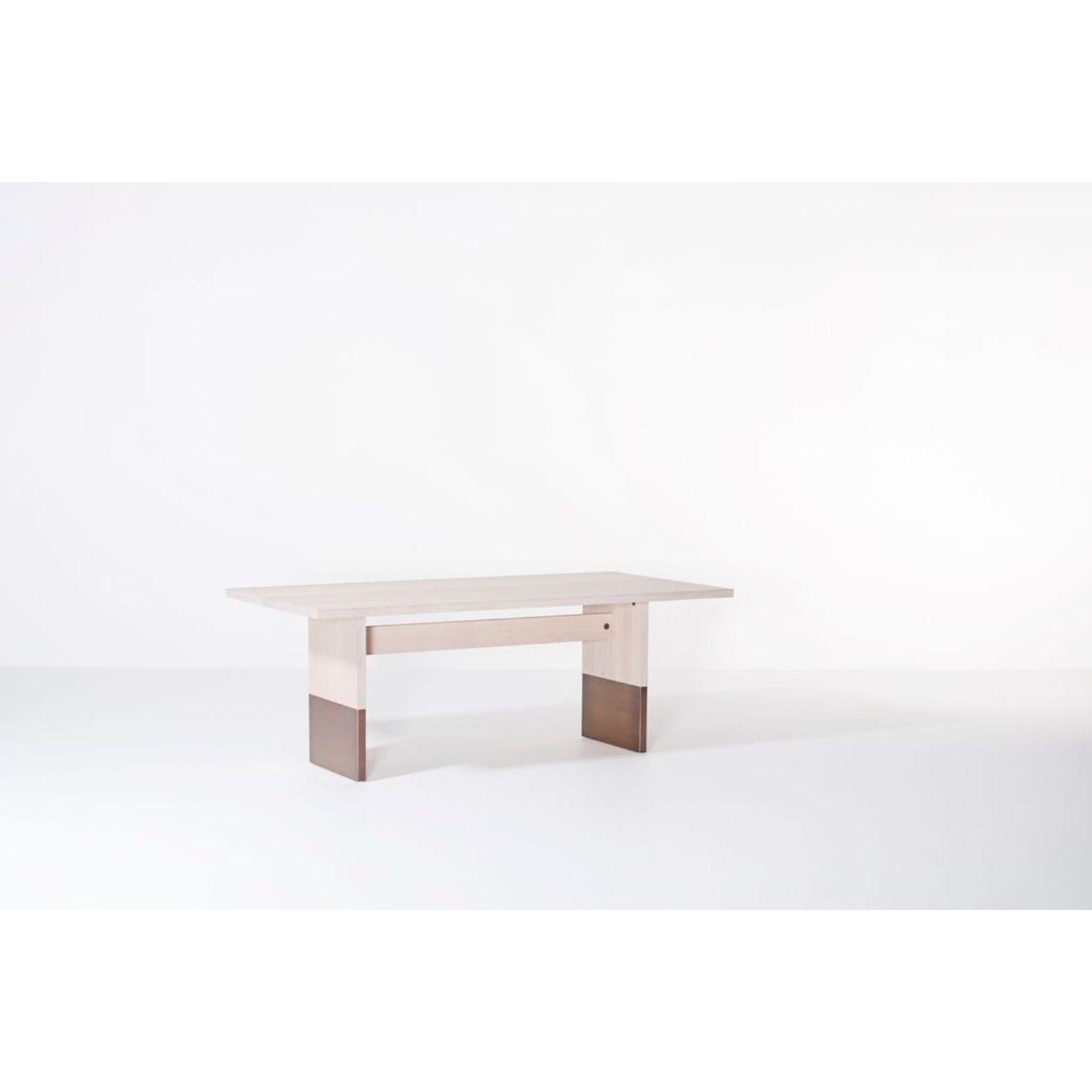 Nota Bene rectangular dining table by Van Rossum.
Dimensions: D200 x W100 x H75 cm
Materials: Oak, brass.

The wood is available in all standard Van Rossum colors, or in a matching finish to customer’s own sample.
Detailing is available in