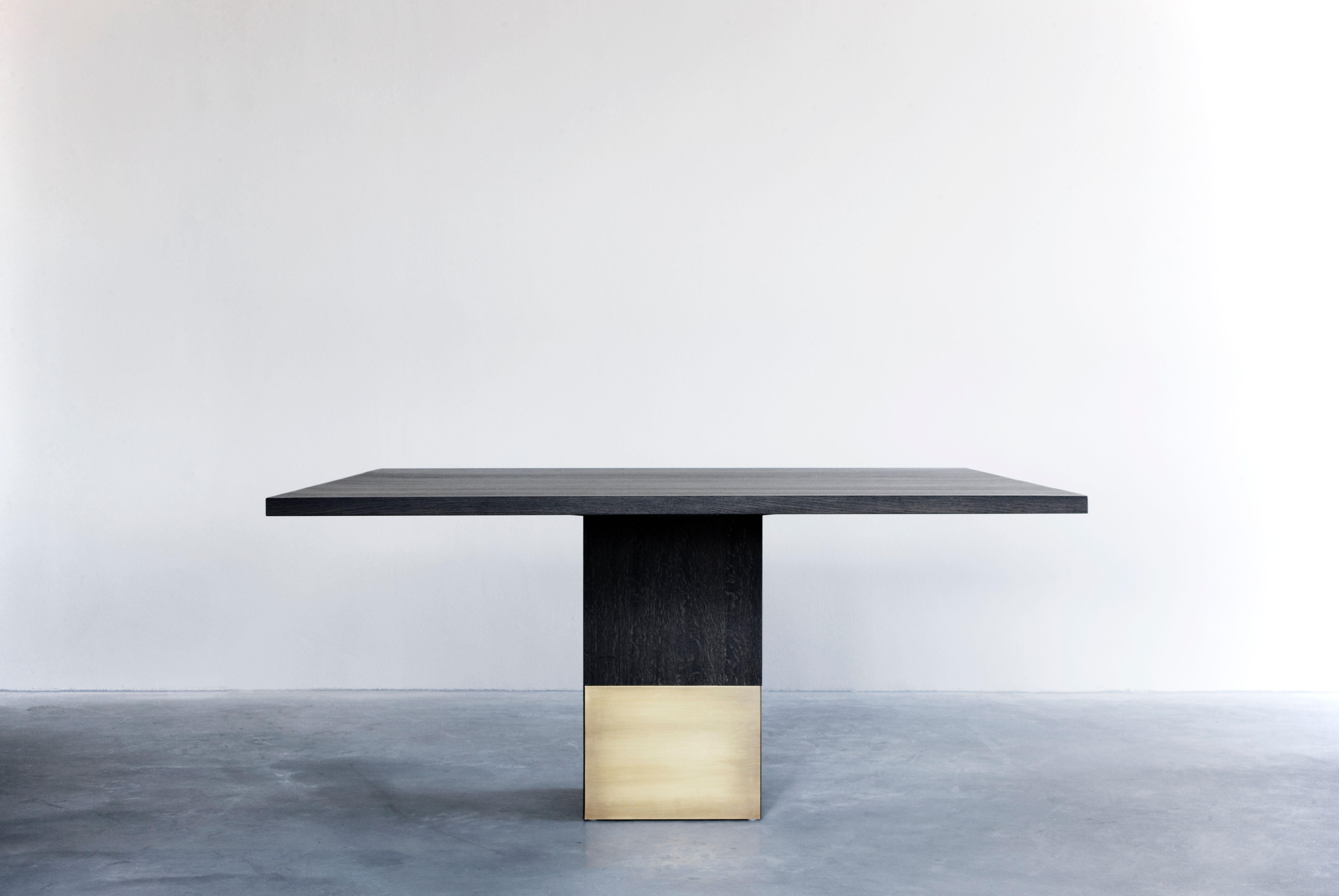 Nota Bene square table by Van Rossum
Dimensions: D140 x W140 x H75 cm
Materials: Oak, brass.

The wood is available in all standard Van Rossum colors, or in a matching finish to customer’s own sample.
Detailing is available in stainless steel