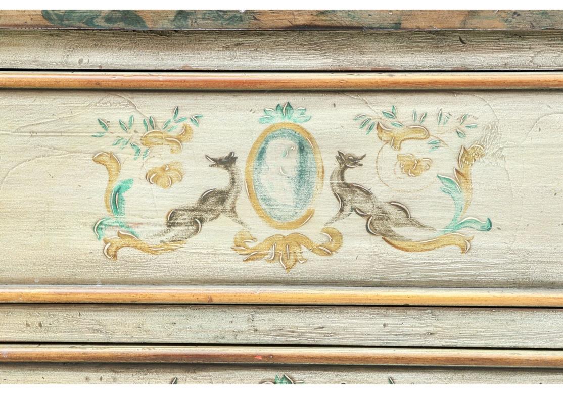 A large and very Decorative all wood Continental style three drawer chest with Cabriolet legs from Karges entirely Hand-Painted by Artist Teresa Brown. The overall coloring is in a fine lighter Blue with Stylized Animals, Oval Portrait Medallions