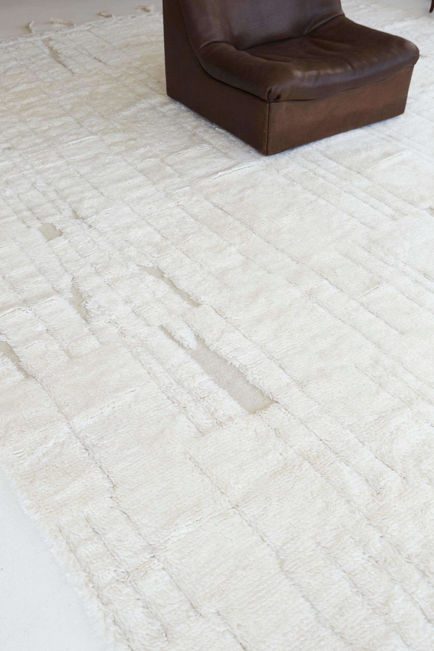 Notes' is an elegant wool embossed shag rug. It is a part of the Design Rhymes Collection which pulls inspiration from different aspects of architecture. Don't let this cream rug fool you with simplicity, it has personality and creates movement and