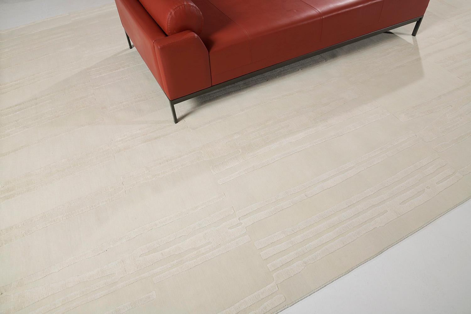 Notes is an elegant wool embossed shag rug. It is a part of the Design Rhymes Collection which pulls inspiration from different aspects of architecture. Don't let this ivory rug fool you with simplicity, it has personality and creates movement and