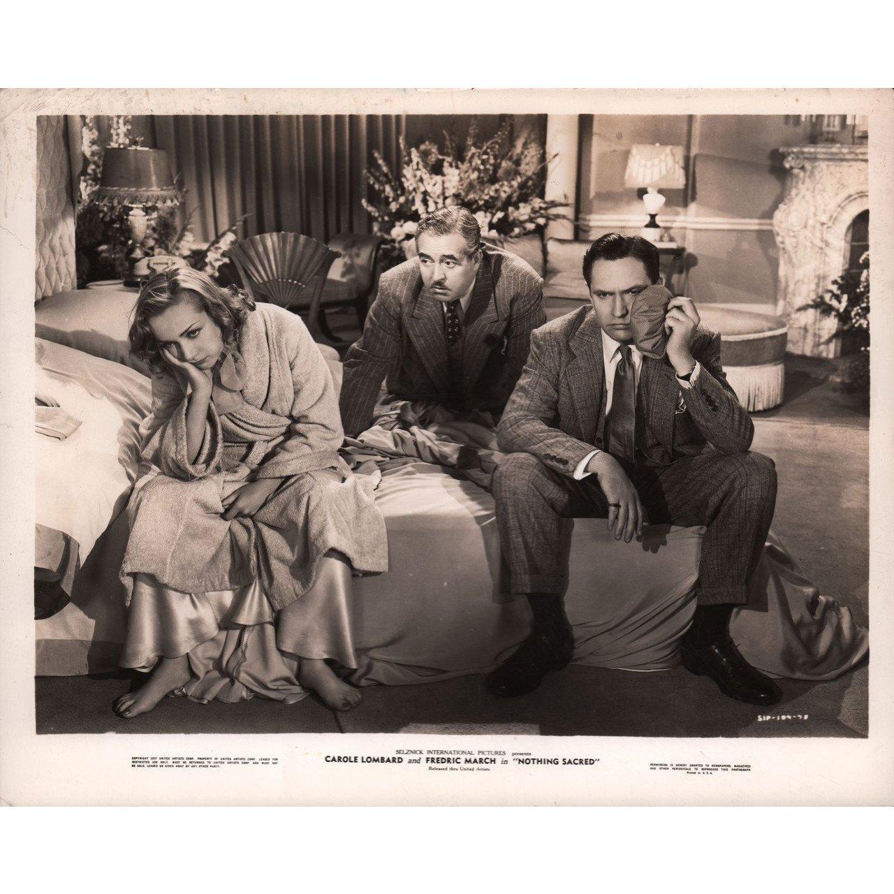 Original 1937 U.S. silver gelatin single-weight photo for the film Nothing Sacred directed by William A. Wellman with Carole Lombard / Fredric March / Charles Winninger / Walter Connolly. Very good-fine condition. Please note: the size is stated in