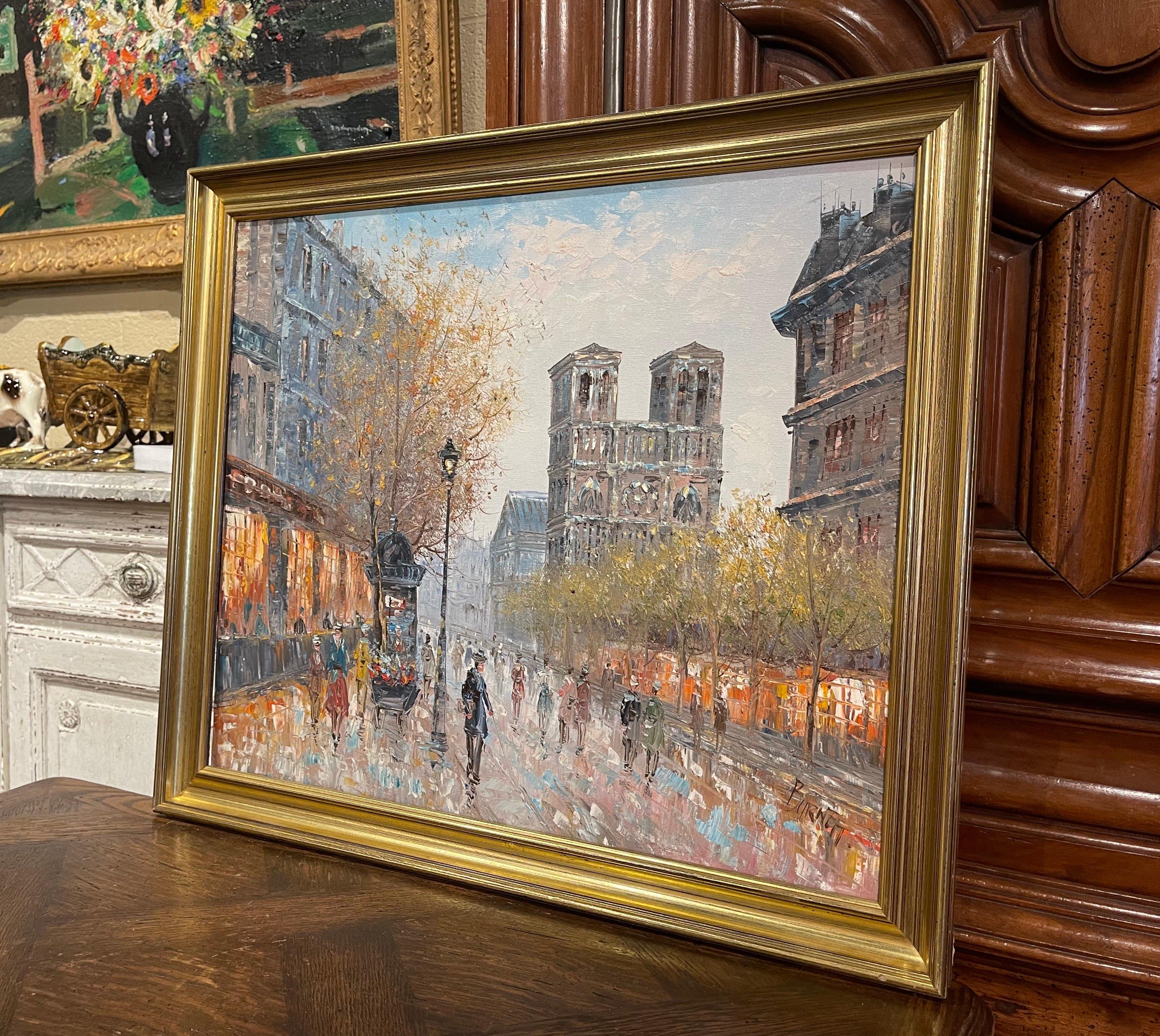 Set in a carved giltwood frame, the painting depicts one of Paris most iconic monuments, Notre-Dame; the artwork of the cathedral at dawn is signed on the bottom right corner by the artist, Caroline Burnett. The oil on canvas is in excellent