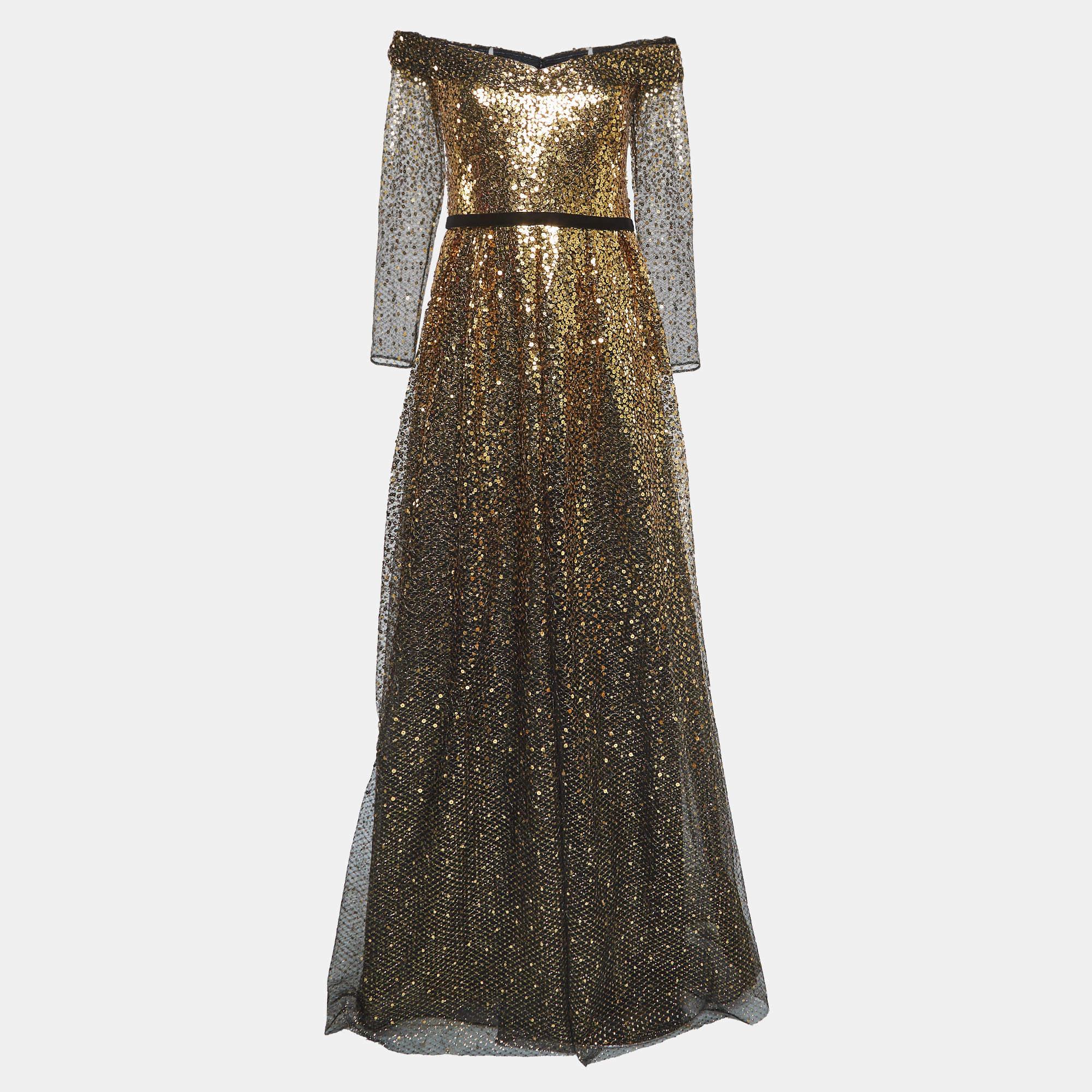 To help you sway in the most mesmerizing way, Notte By Marchesa brings you this gown. It is a marvelous design, achieved by using sequin embellishments. The hemline falls gracefully to the floor and a zipper makes sure the gown fits you perfectly.

