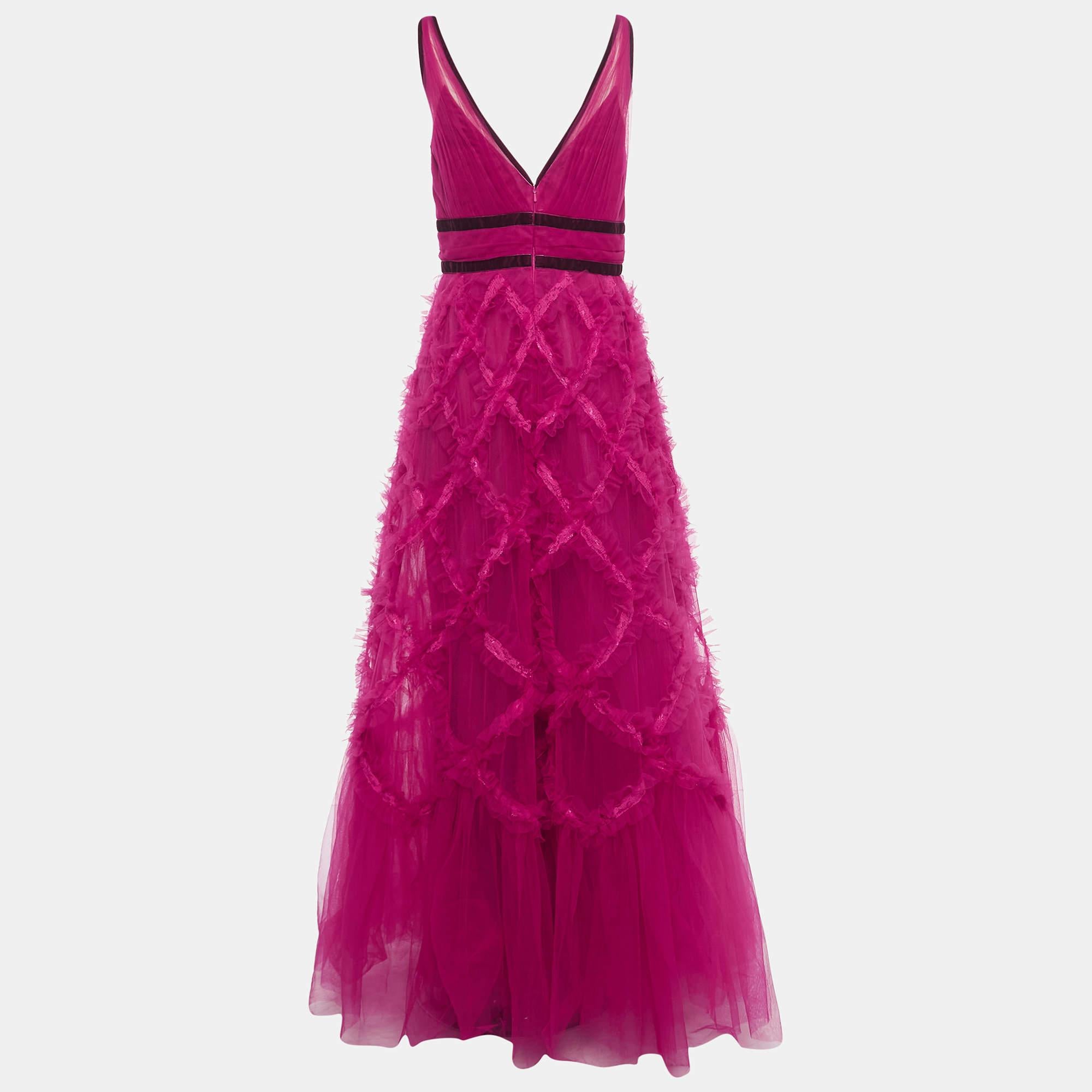 Dress up in this designer gown and deliver a sophisticated look every time. Crafted from quality materials, it comes in a pretty shade of pink. The gorgeous gown has ruffle details and a zip closure. It will match well with open-toe heels and dainty