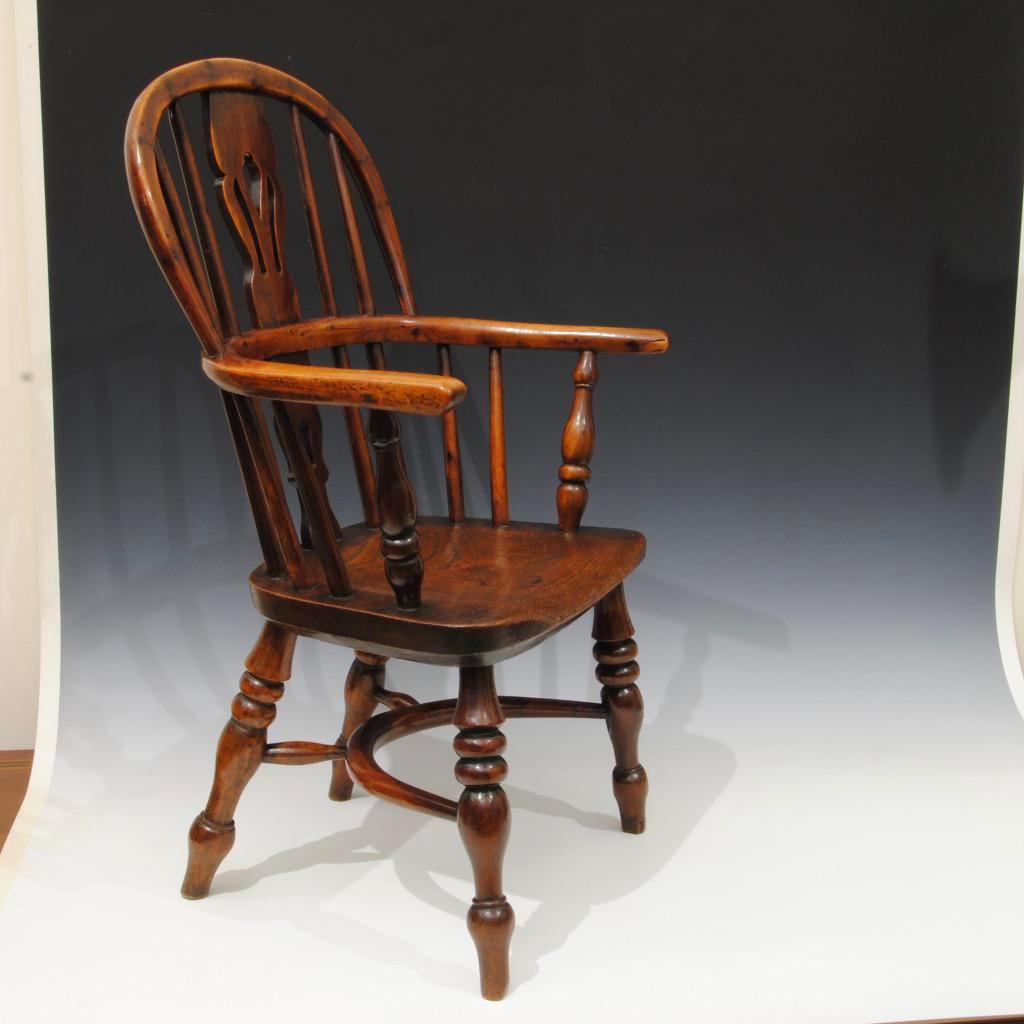 A super example of a Nottinghamshire childs yew tree windsor armchair, of great colour and patina.