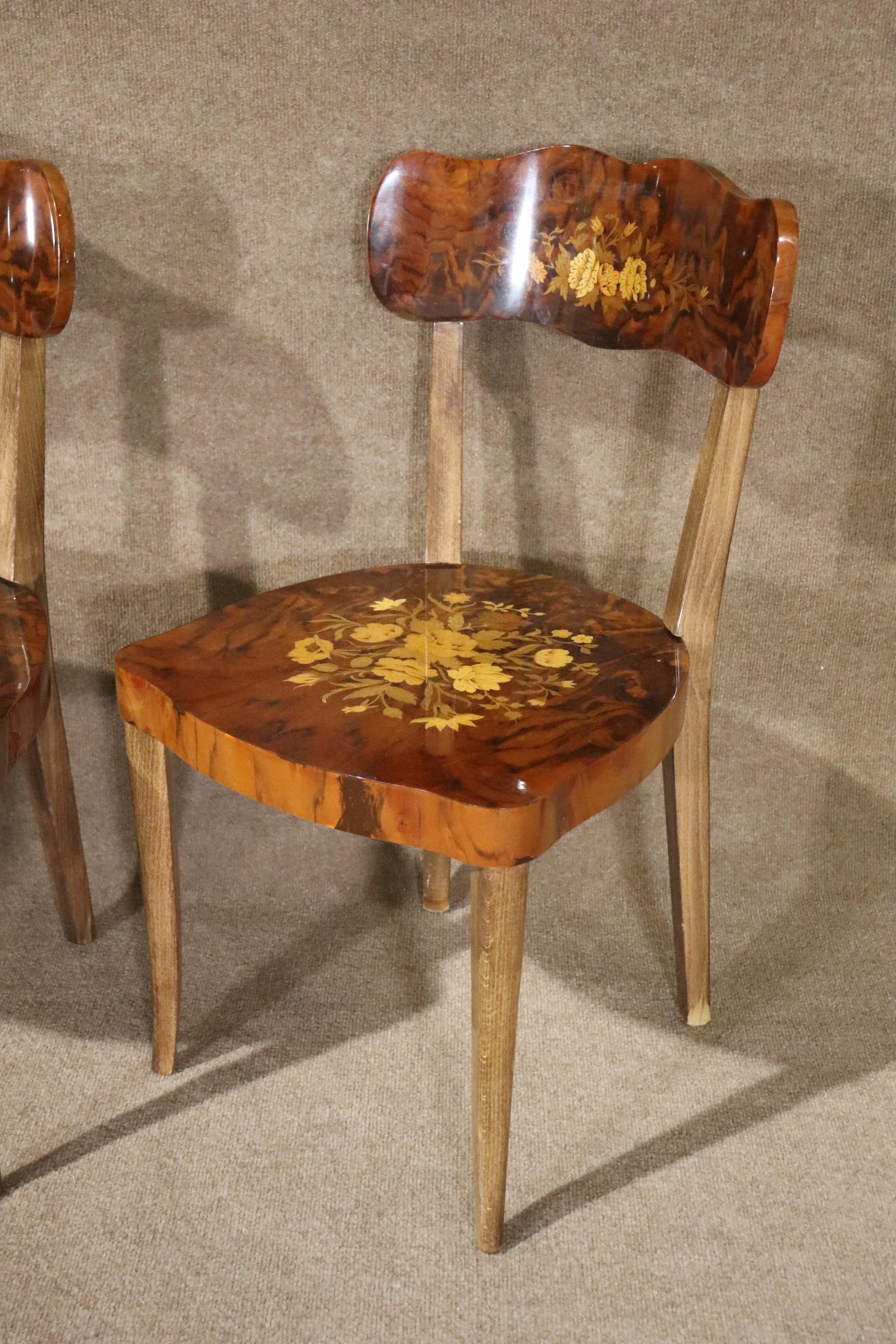 Set of four Italian chairs by Notturno Intarsio. Features stunning marquetry inlay designs on backs and seats.
Please confirm location NY or NJ