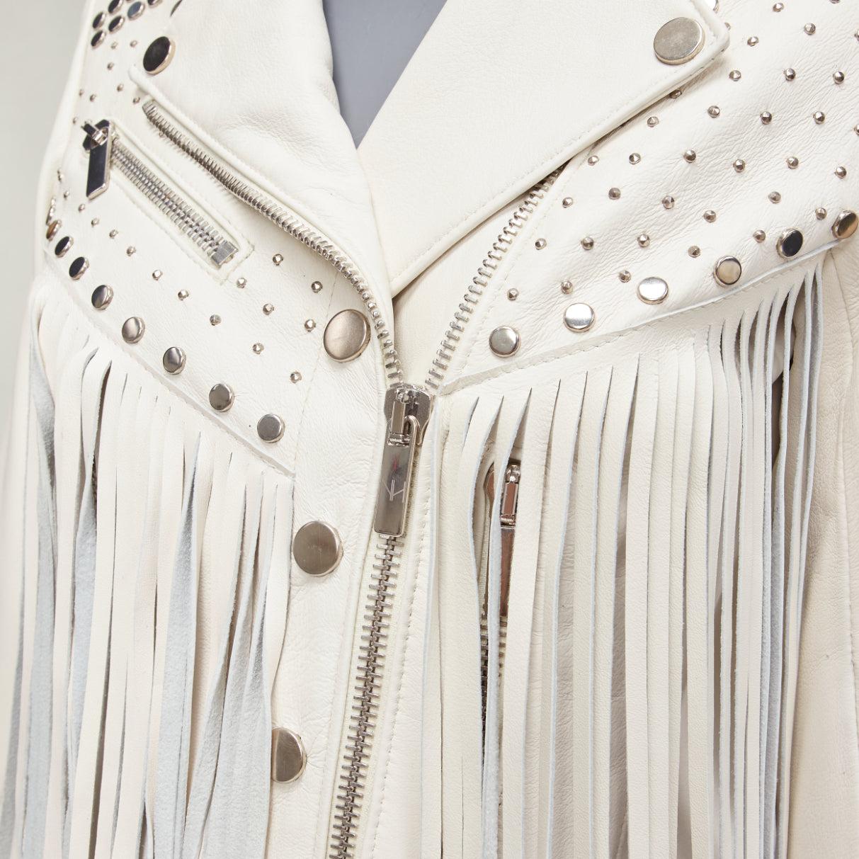 NOUR HAMMOUR cream lambskin fringe silver studs western biker jacket FR34 XS
Reference: AAWC/A00723
Brand: Nour Hammour
Material: Lambskin Leather
Color: Cream, Silver
Pattern: Solid
Closure: Zip
Lining: Black Fabric
Extra Details: Silver studs at
