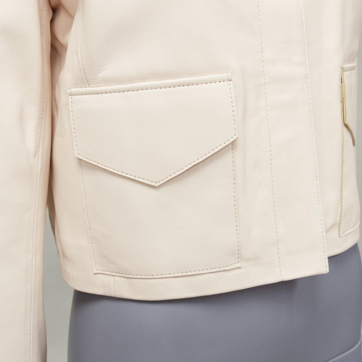 NOUR HAMMOUR cream lambskin minimal dual pocket cropped zip jacket IT36 XXS
Reference: LNKO/A02256
Brand: Nour Hammour
Material: Lambskin Leather
Color: Cream
Pattern: Solid
Closure: Zip
Lining: Silver Fabric
Extra Details: Nour Hammour Lambskin