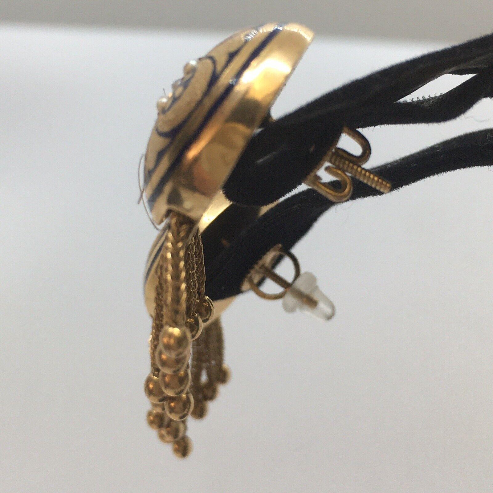 Art Nouveau1900s American Seed Pearl Tassel Drop Stud Enamel Earrings

Hallmark, 14K
Weighing 12.7 gram
29 mm circular top
Hanging 1 inch
Screw back, could be modified upon request