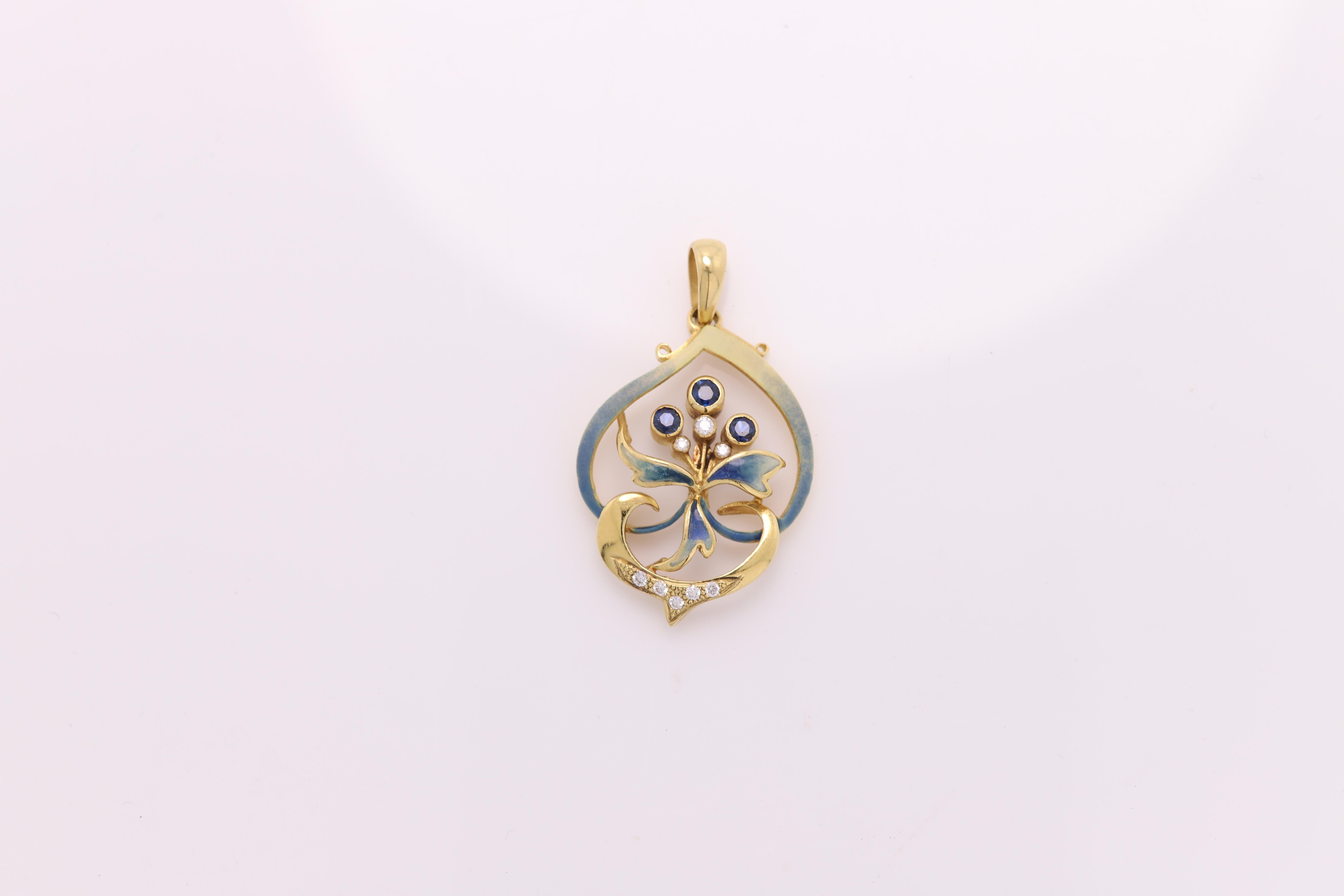 Vintage Hand made in Spain Enamel pendant
18K Yellow Gold 
approx size 1.25'  inch (30mm)
has few Diamonds  0.15 carat
and 3 blue sapphires 0.30 carat
Weight 6.7 grams
Style is based from the period of Nouveau era
made approx.  20+ years ago
Overall