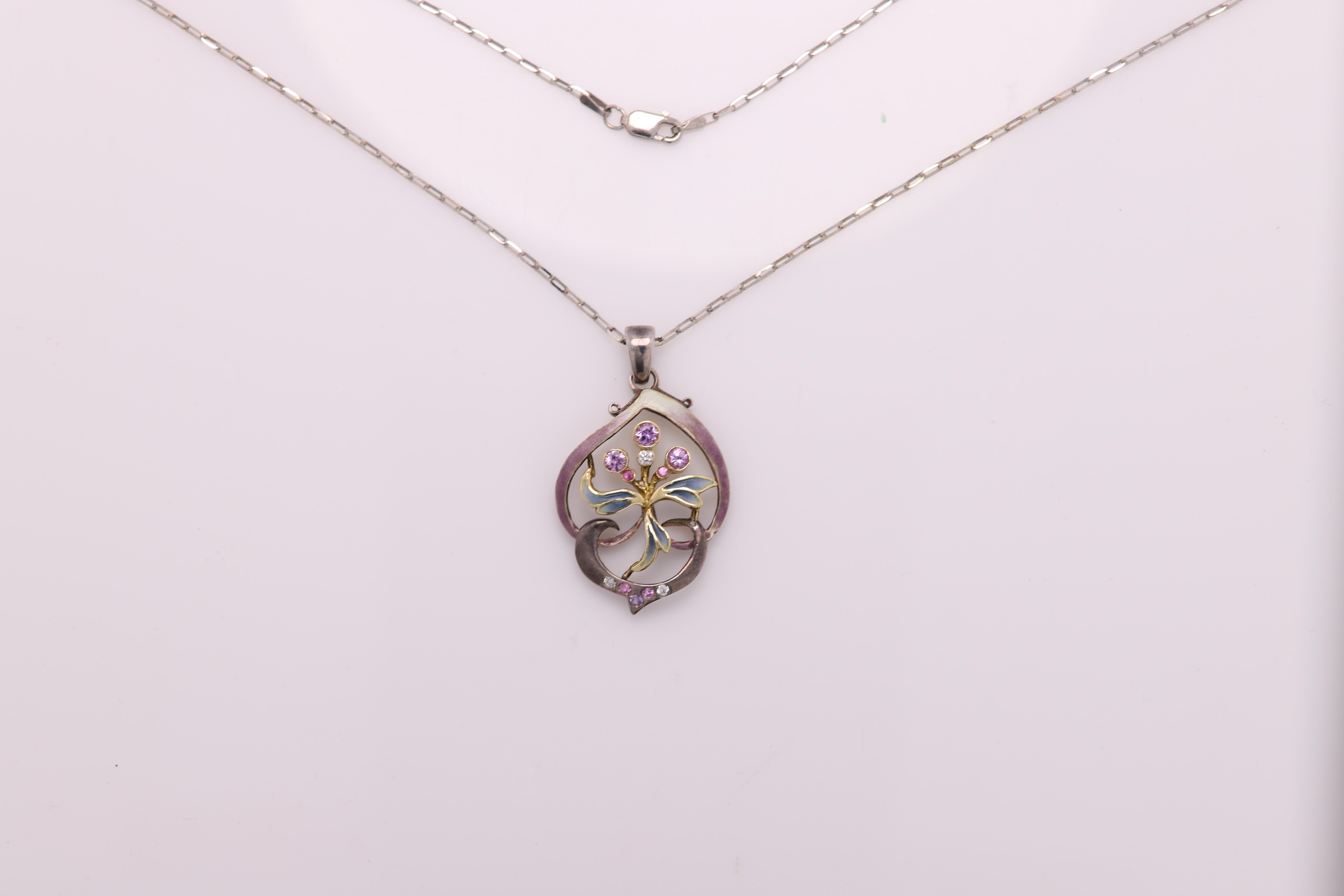 Beautiful Vintage Hand made in Spain Enamel pendant
Oxidized Sterling Silver and 18 yellow Gold 
approx size 1'  inch (30mm)
pink and white natural gemstones (tourmaline and diamonds) 
Weight approx 7 grams
Chain length 17' inch (18k white gold)