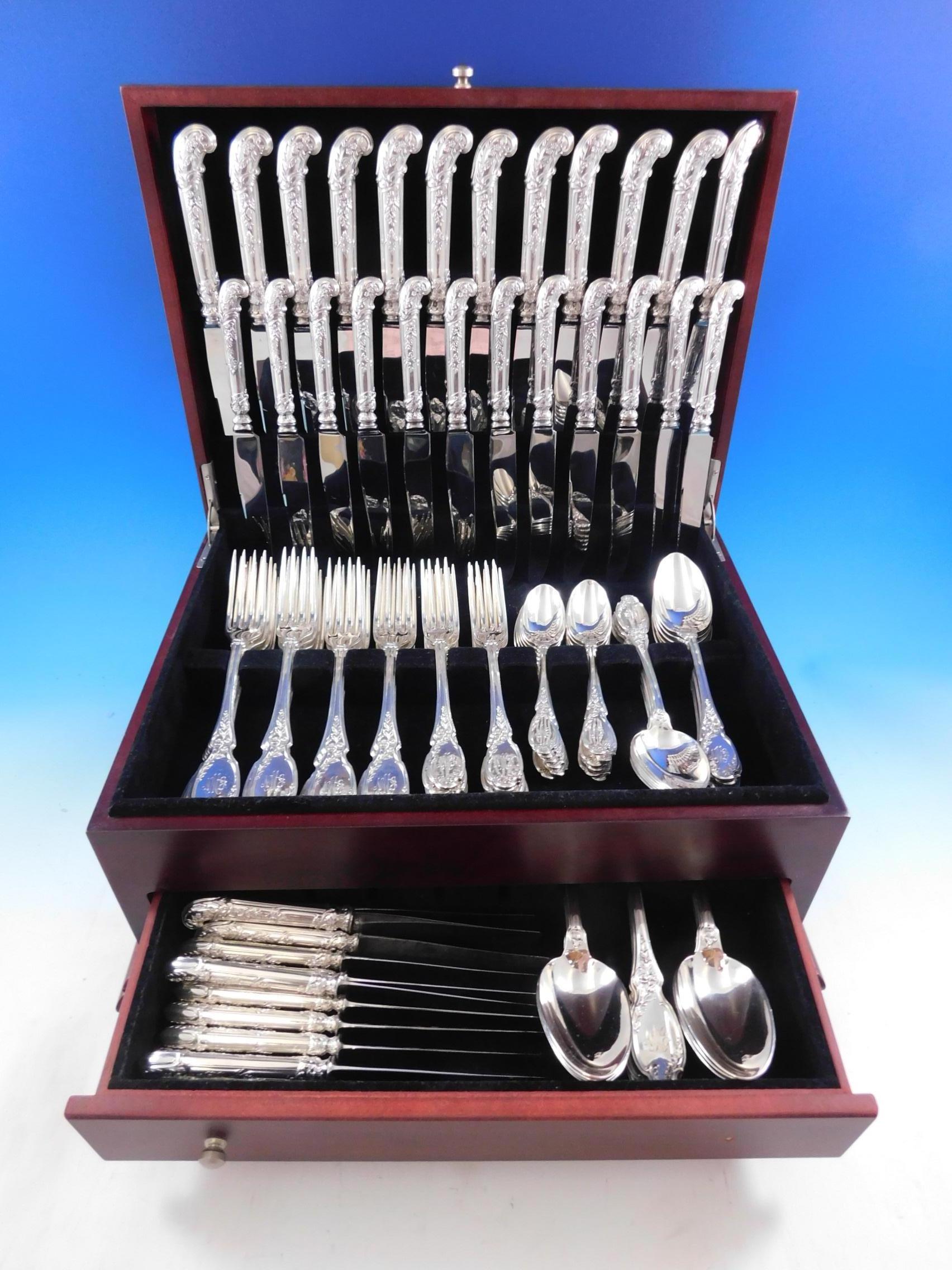 Outstanding Nouveau by Leroy & Cie / Piault, circa 1886-1897, French silver Flatware set - 102 pieces. This Art Nouveau pattern features a shaped terminal with cascading floral scroll work and wonderful pistol grip handles on the knives. This set