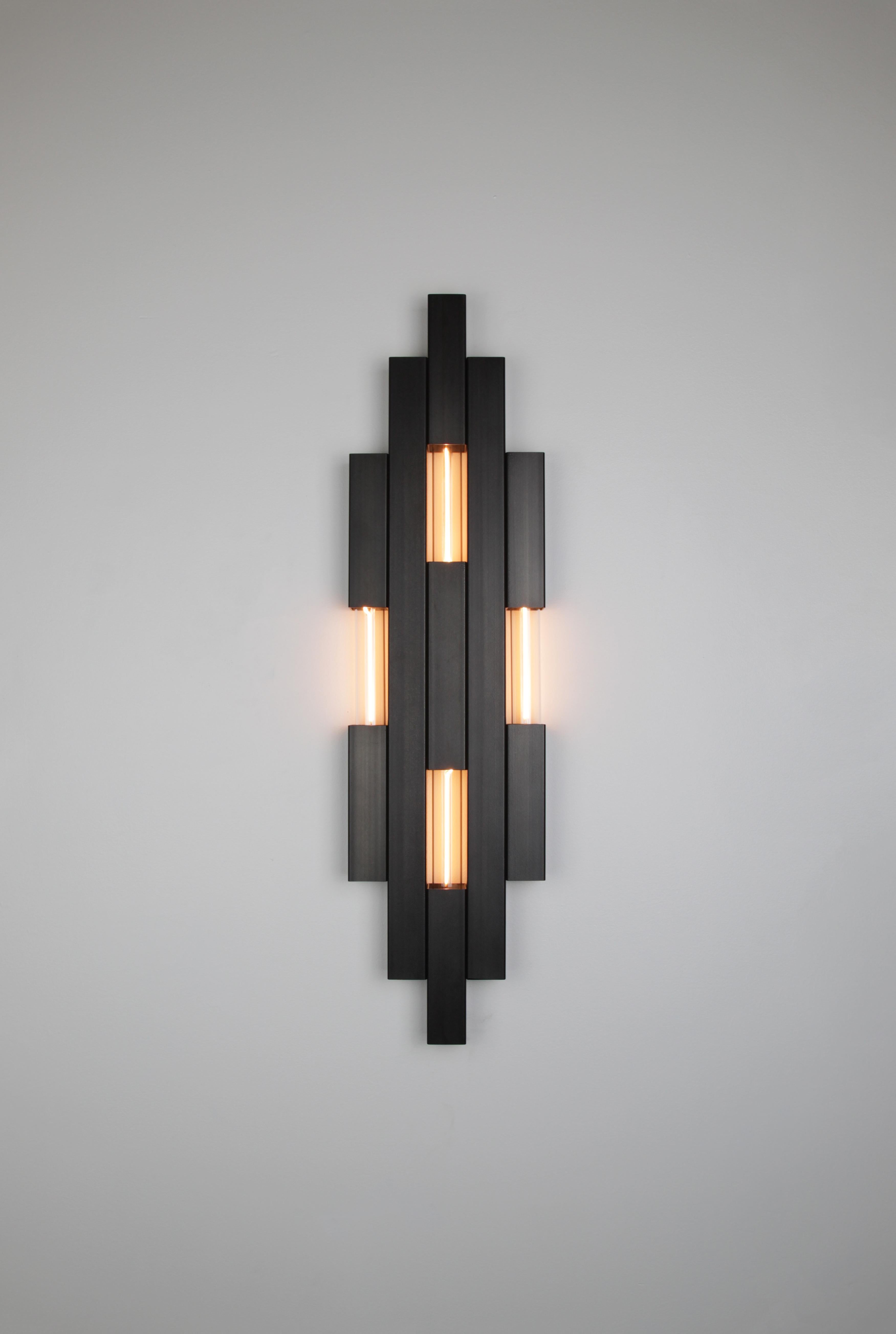 Nouveau Sconce  Daikon - Steel

material options: steel, brass, stainless steel (please message for brass or stainless price)

finish options: 
steel- Industrial clear, onyx black wax, satin black, satin white
brass- brushed brass, aged brass, naval