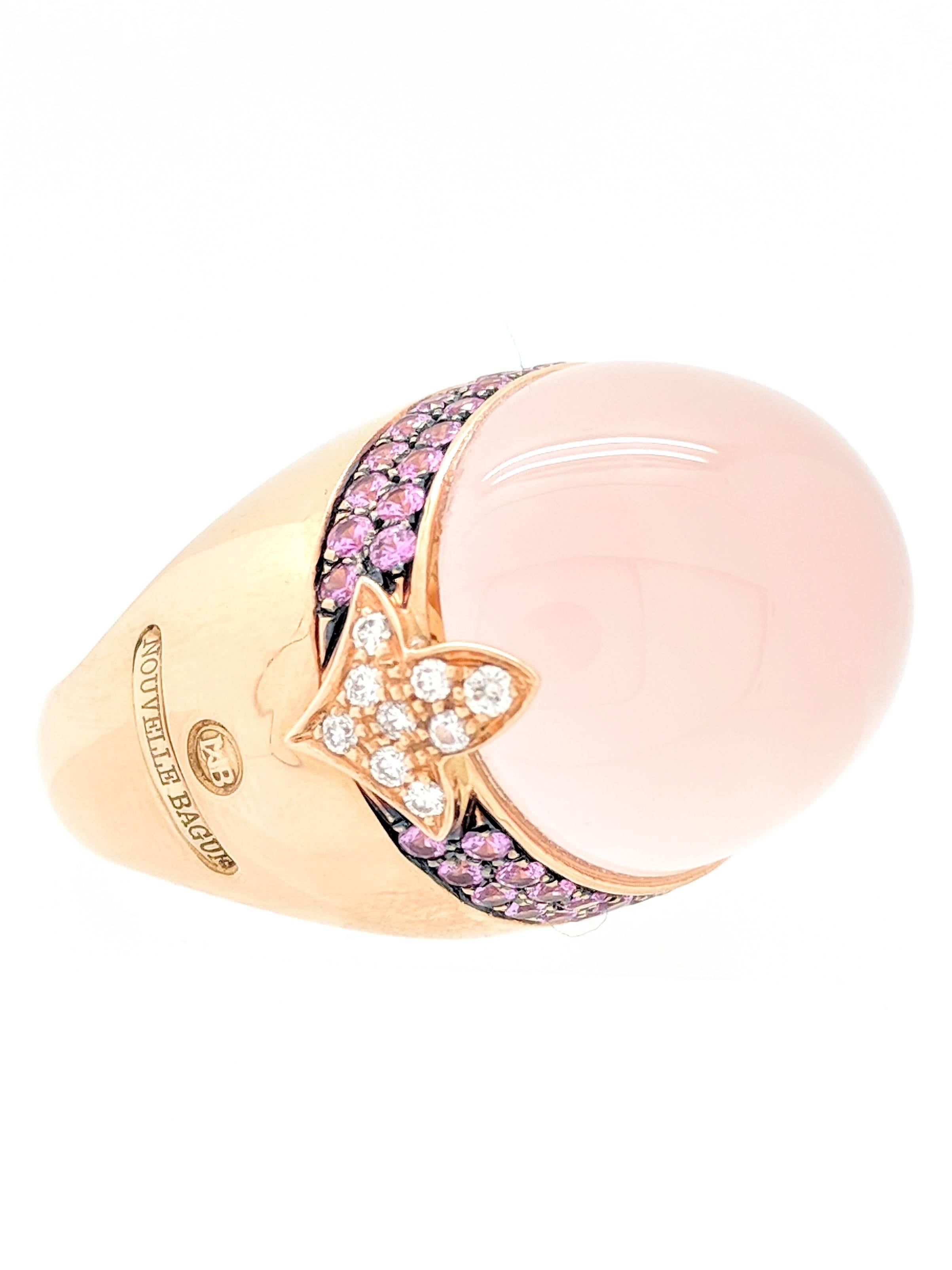 You are viewing a very unique and beautiful cocktail ring designed and produced by Nouvelle Bague. Guaranteed to be a conversation piece, this ring is crafted from 18k rose gold and weighs 26.5 grams.  It features one (1) Cabochon shaped Pink Coral