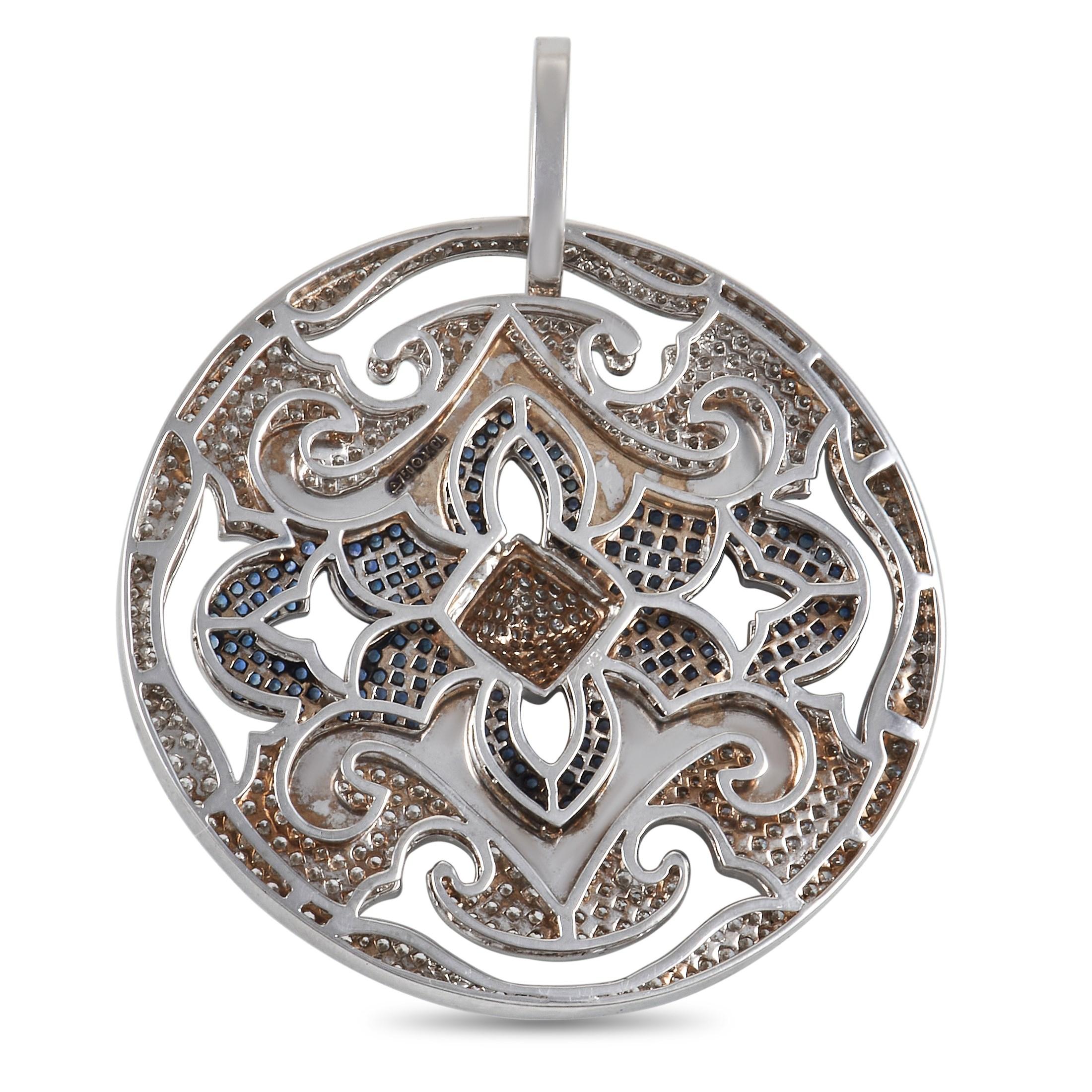Designed with a fairytale charm, this diamond and sapphire pendant will bring a hint of enchanting elegance to your looks. This 3x2.45-inch round pendant features a flat disc profile with ornamental flourish design cut-outs. The pendant comes