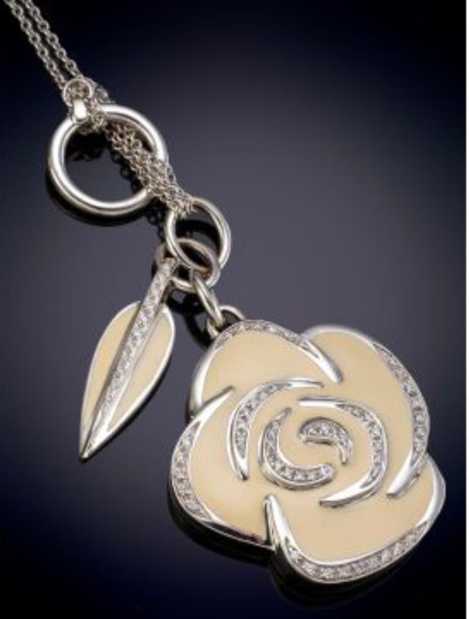 Nouvelle Bague 18k white gold enamel and diamonds Chamelia Pendant Necklace 
Also available in Black enamel and ebony wood reverso 
This 18 karat white gold , diamond and enamel necklace is designed by the world renowned Italian company La Nouvelle