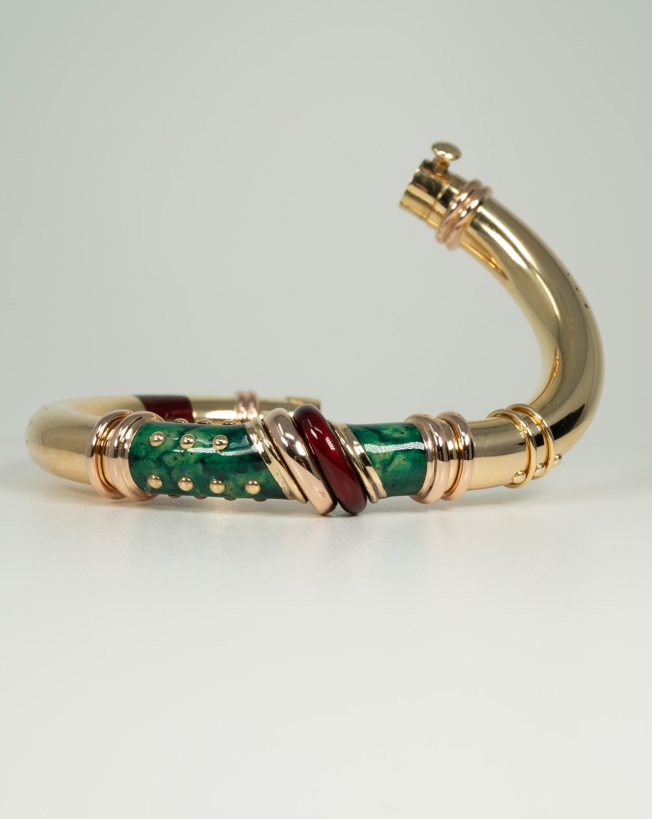 In 18 karat yellow gold, this beautiful enamel bracelet is by Nouvelle Bague. 

Please note: length measurement is approximate.