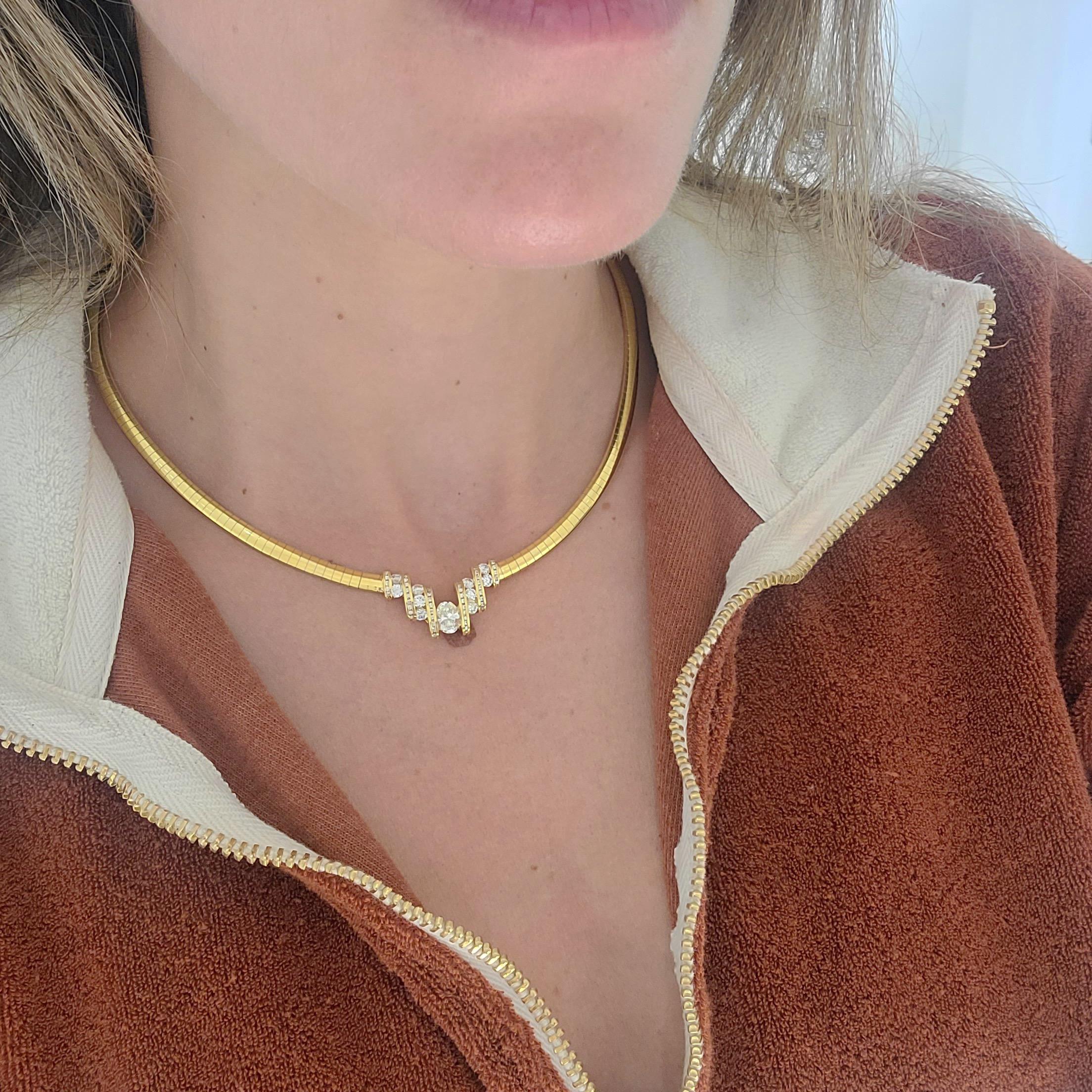 Designed by Nova, this 18 karat yellow gold choker necklace is a real showstopper. The centerpiece is the 0.85 carat oval diamond. Four rows of invisibly set round brilliant cut diamonds flank the center stone. The central motif  is set into a 16
