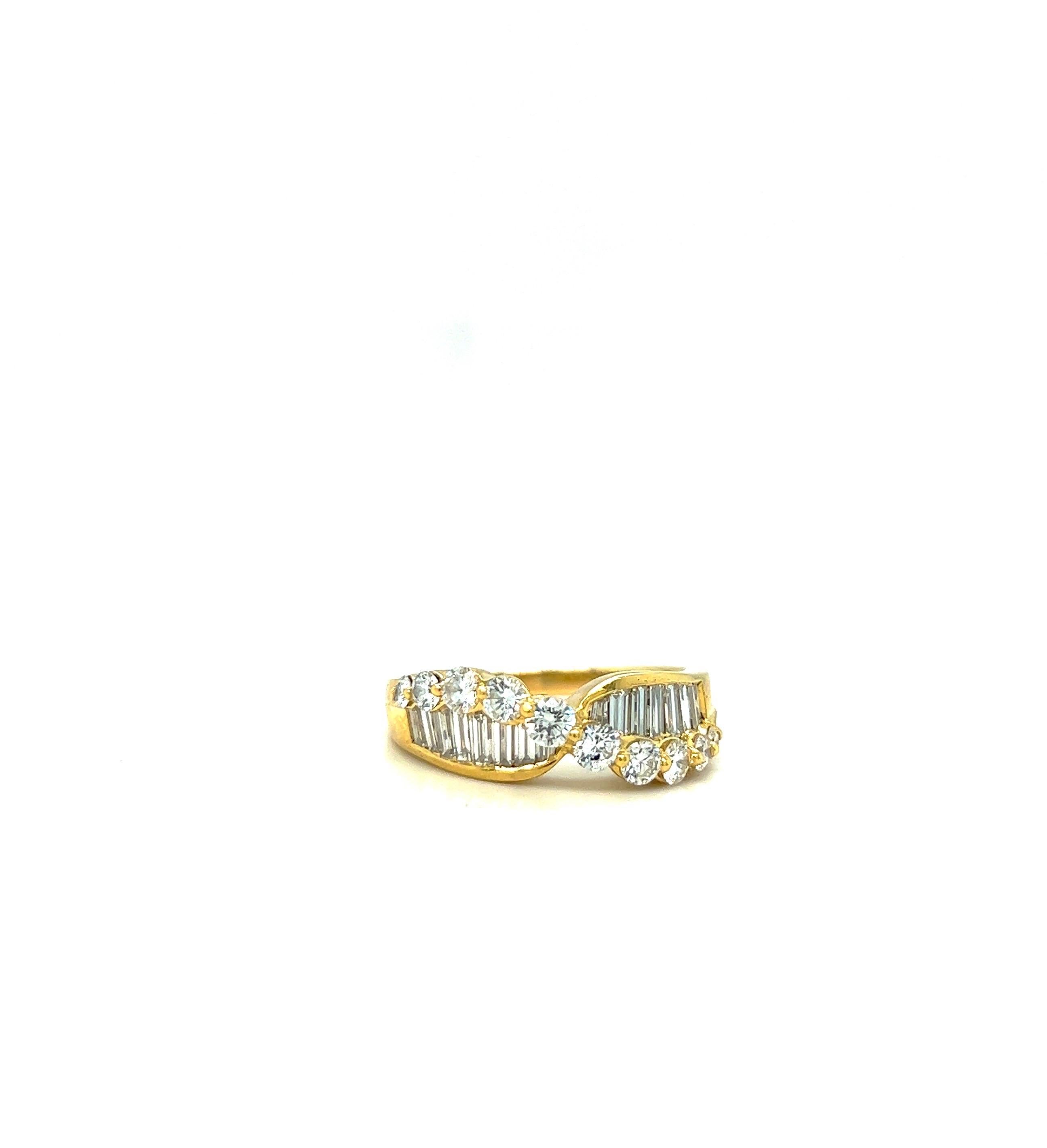 Beautiful 18 karat yellow gold ring set with baguette and round diamonds. The baguette diamonds are set vertically ,as the round brilliant prong set diamonds gracefully curve across from east to west. There is a round diamond set in a triangular