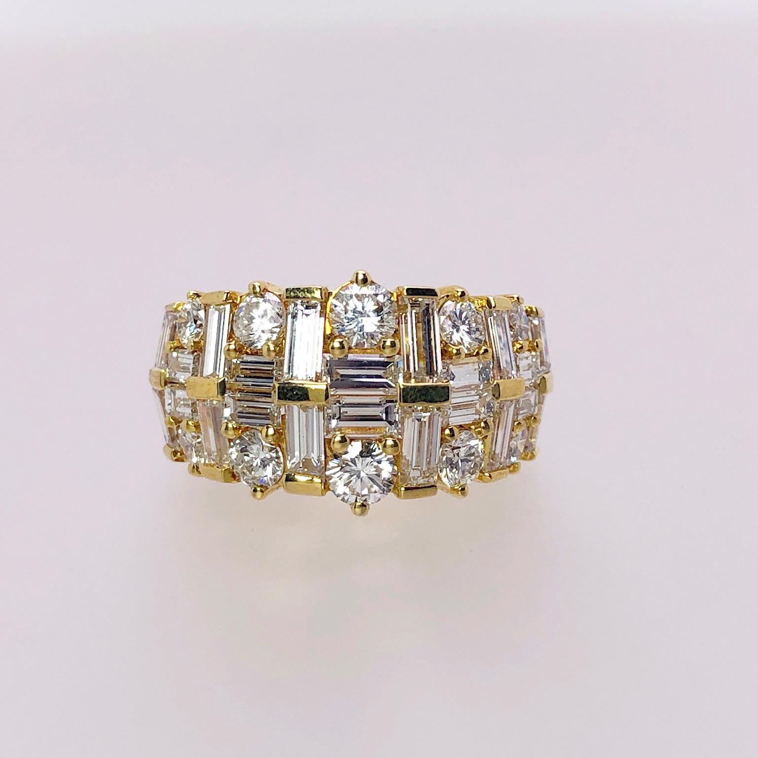 This 18 karat yellow gold ring was designed by Nova. A beautiful setting highlighting Round and Baguette cut Diamonds . The Diamonds are set in a basket weaved type setting allowing the  brilliance of each cut to sparkle beautifully.
Ring size 6.5 