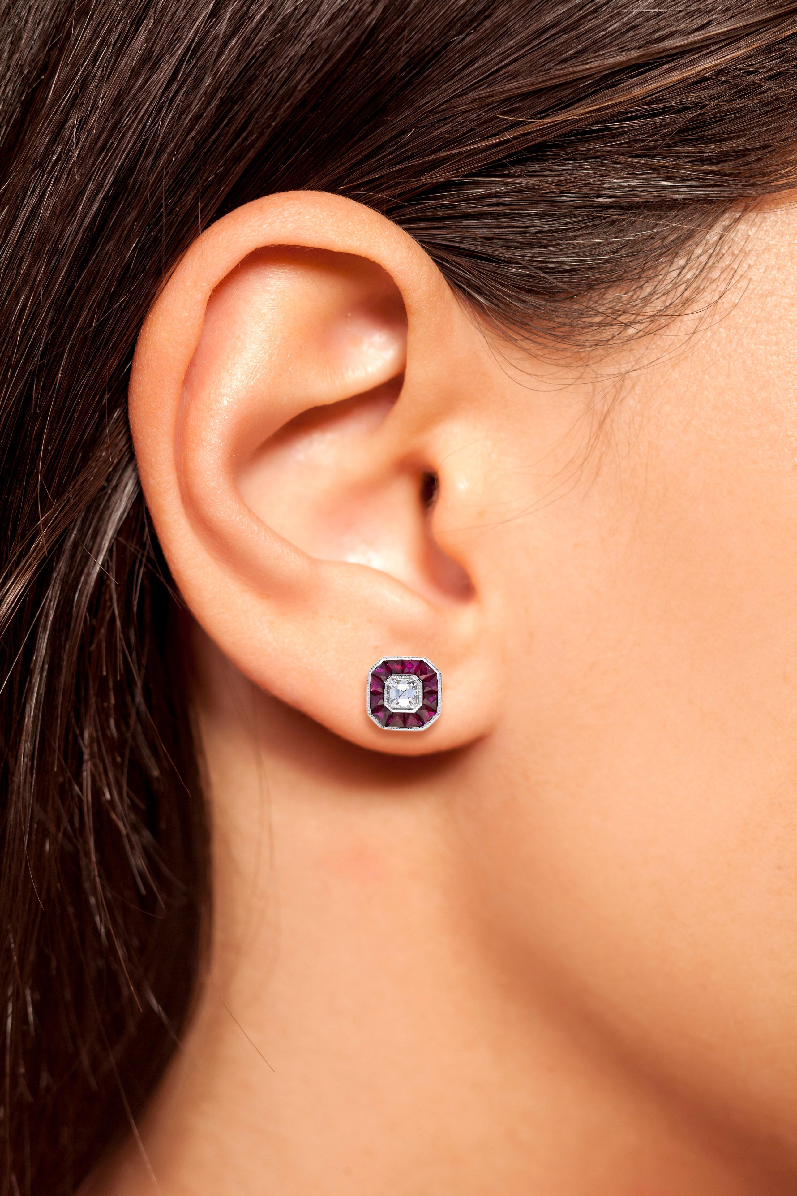 These Art-Deco stud earrings are completely spectacular! The vibrant color stone (you can select Blue Sapphire, Emerald, Ruby) is a specialty cut to surround the excellent emerald cut center diamond, which is in a thin bezel with millgrain detail.