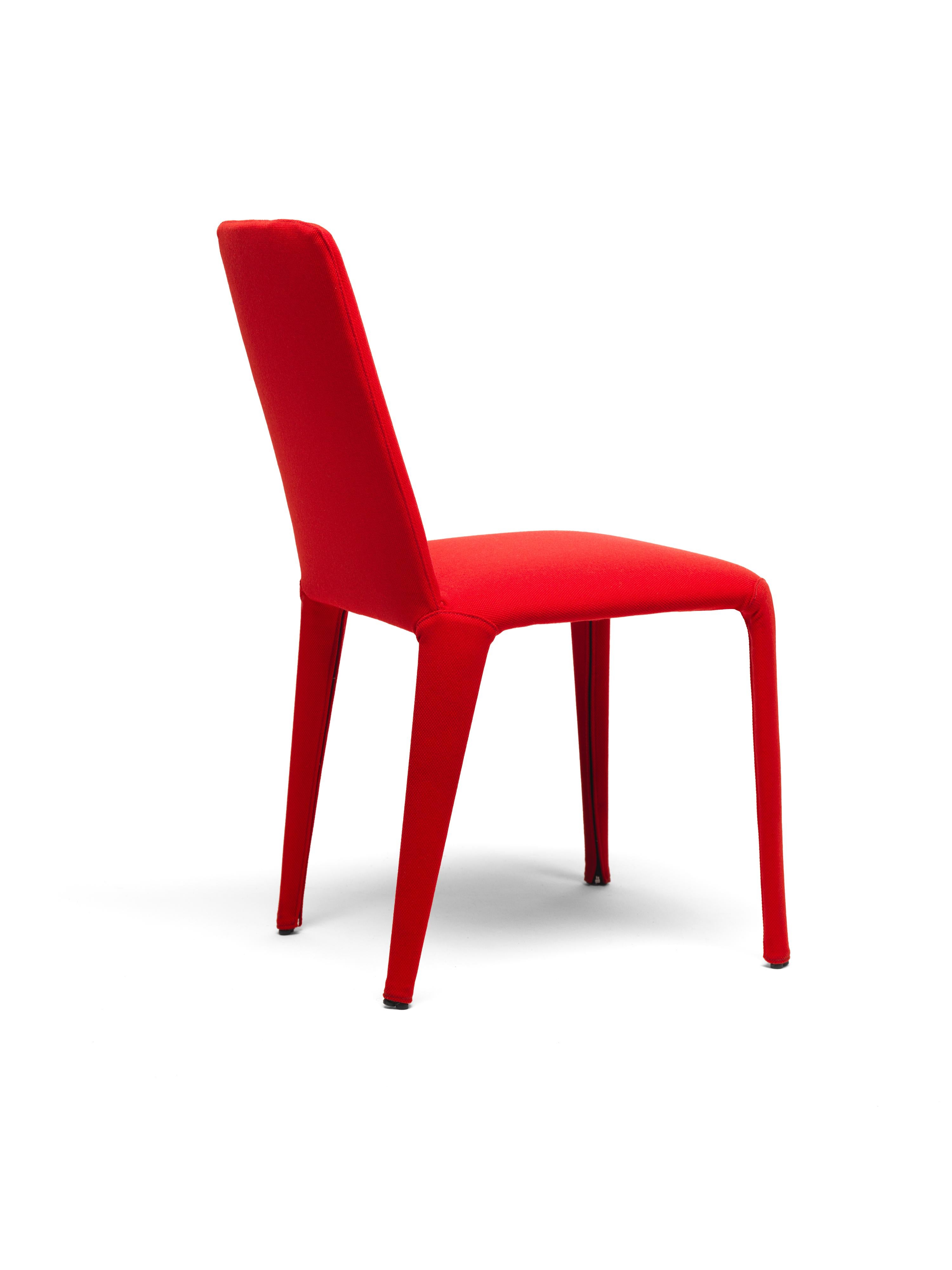 Nova is a light-weight textile chair with a precious look and a fully removable fabric cover. The internal structure is a minimal metal rod skeleton that supports the elastic straps and the polyurethane cushions and that determines the form of the