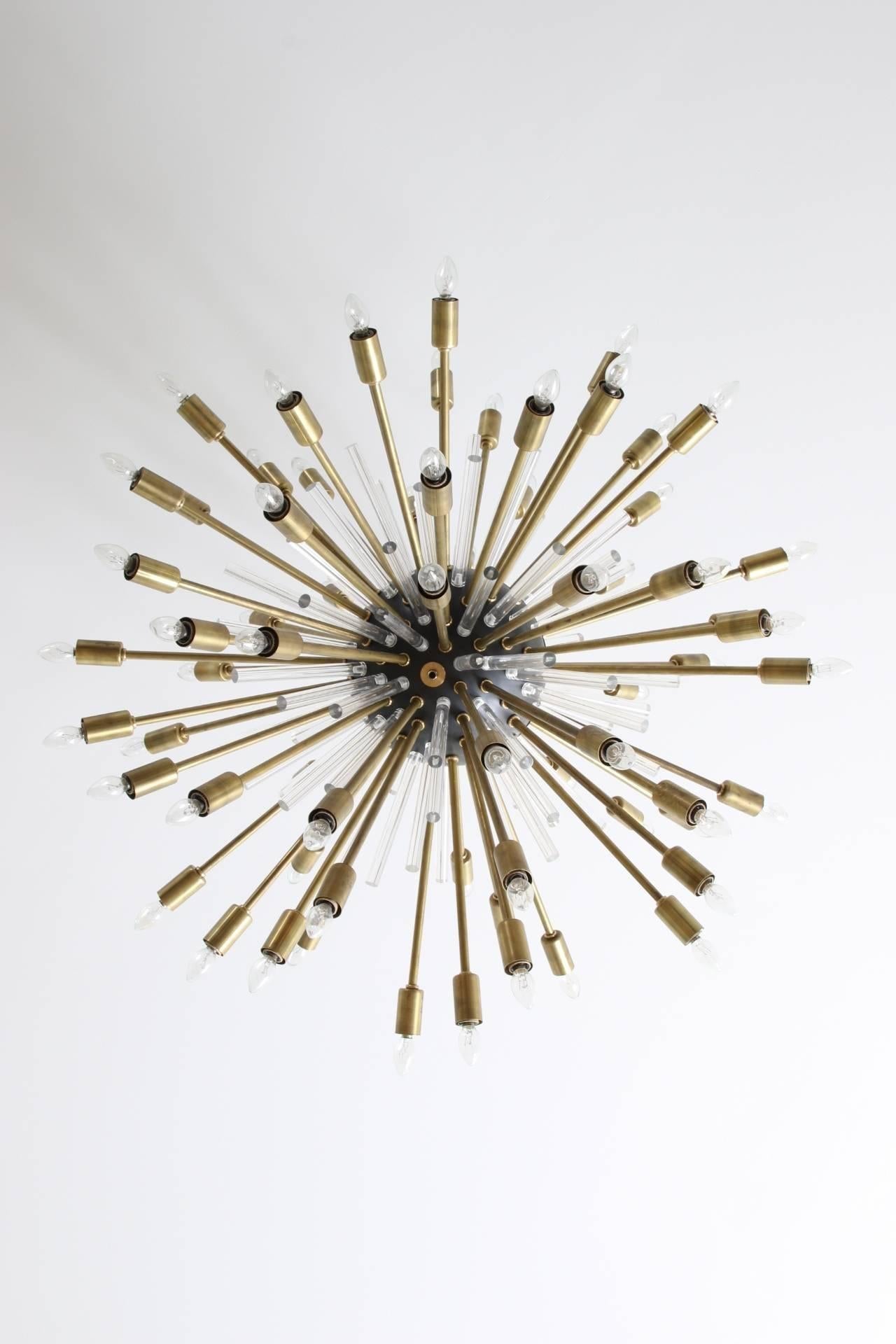 Sputnik style chandelier 'Nova' from Downtown's Classic collection.
148 Arms, 74 brass arms with light bulbs and 74 Lucite arms. Materials used are brass, oil rubbed bronze and lucite. Excellent condition.