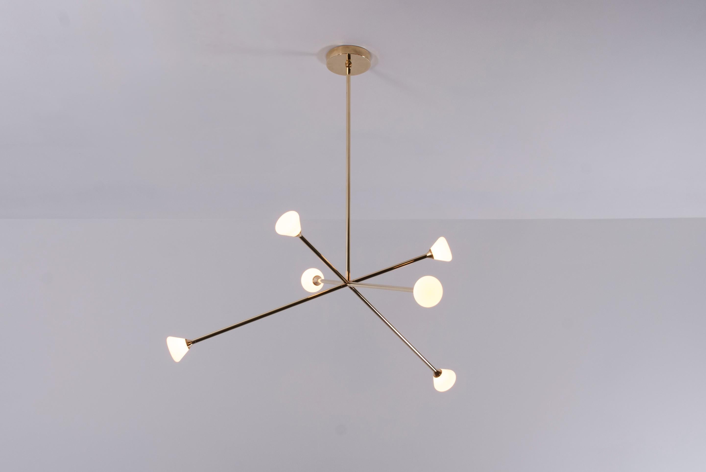 The Nova chandelier is centerpiece fixture with an elegant and energetic composition. This contemporary chandelier branches out from a central point in a pure, geometric manner. It features six white glass shades that house powerful, dimmable LED's.