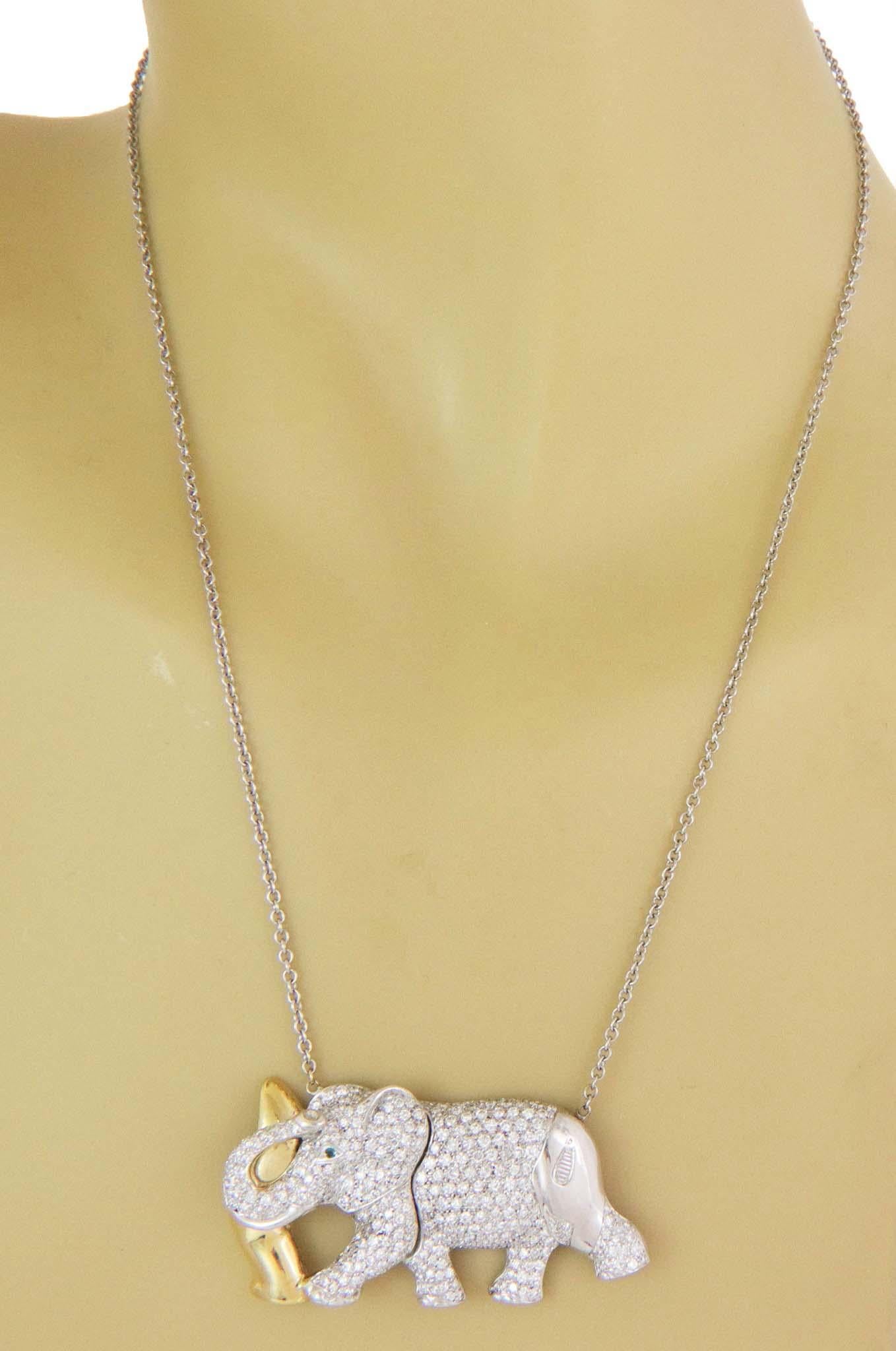 Adorable and authentic by Nova Italy, this beautiful elephant pendant and chain is crafted from 18k white and yellow gold. The classic oval link chain is attached to the pendant featuring a large standing elephant in white gold fully decorated with