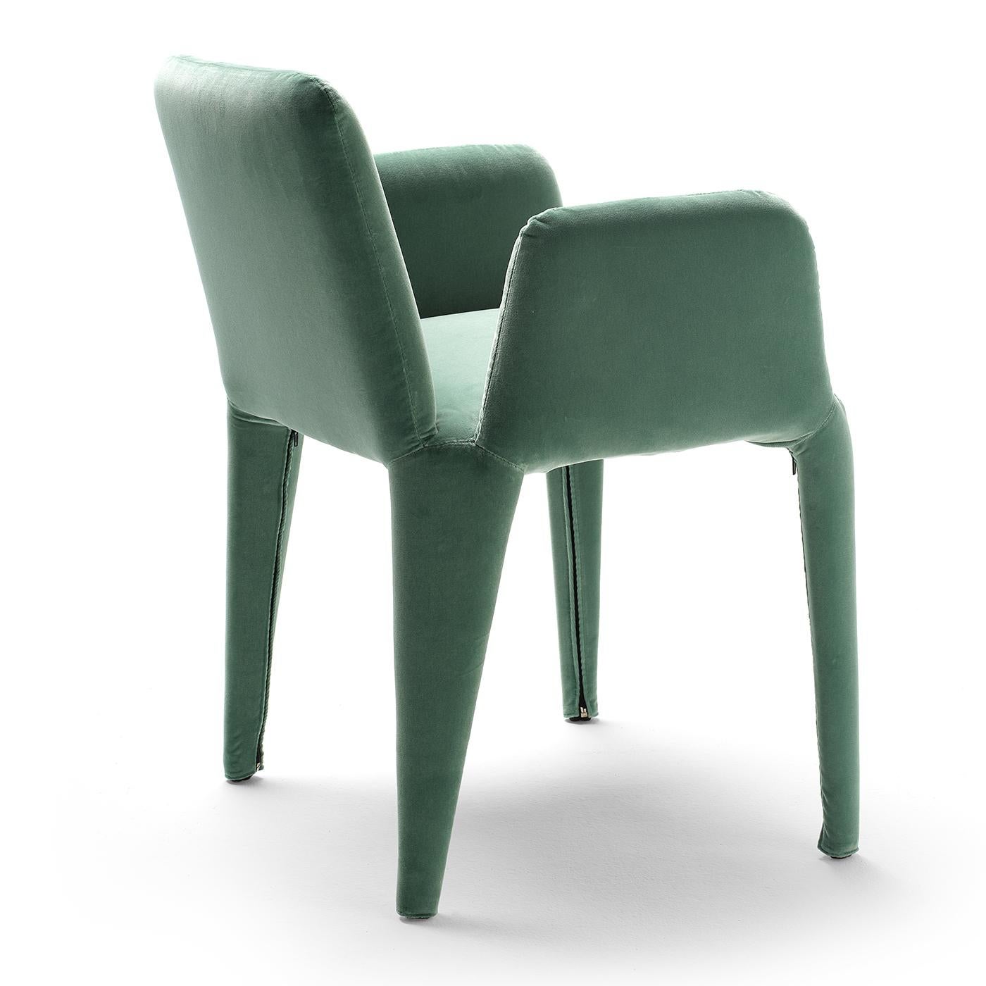 Fresh and stylish, this refined armchair boasts a dynamic silhouette entirely lined in Dacron and wrapped in a soft, green-hued fabric. Its outstanding lightness is the result of the superb pairing of the lightweight metal rod frame that sustains