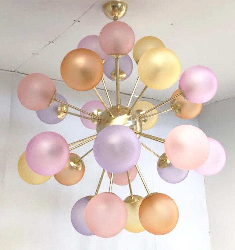 Italian sputnik chandelier with 24 Murano glass globes in satin matte finish, mounted on brass frame / Designed by Fabio Bergomi for Fabio Ltd / Made in Italy
24 lights / E12 or E14 type / max 40W each
Measures: Diameter 35.5 inches / Height 39.5