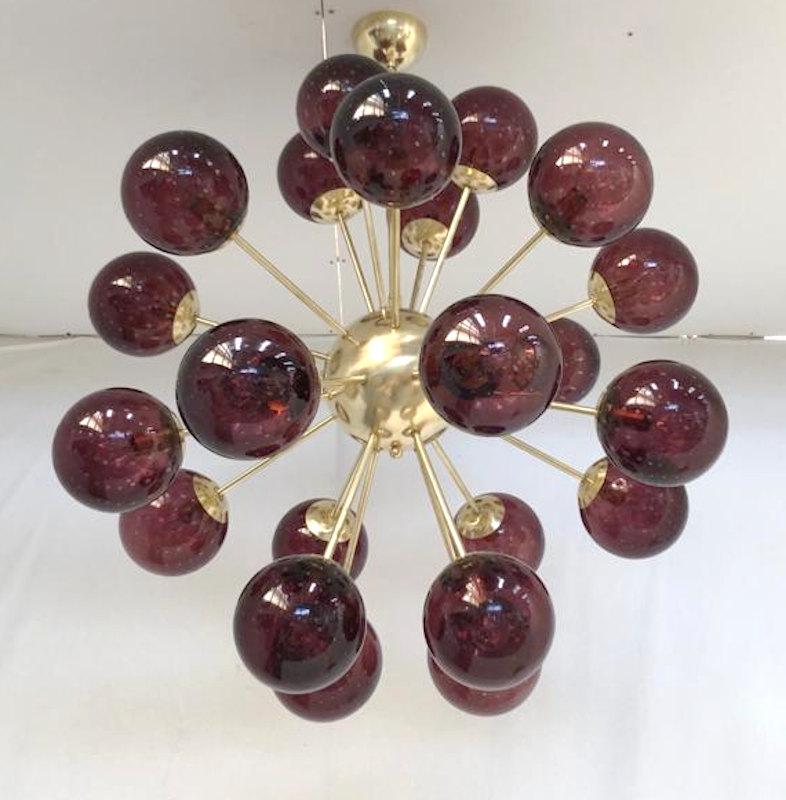 Italian sputnik chandelier with 24 Murano glass globes mounted on brass frame / designed by Fabio Bergomi for Fabio Ltd / Made in Italy
24 lights / E12 or E14 type / max 40W each
Measures: Diameter 35.5 inches, height 39.5 inches including rod and