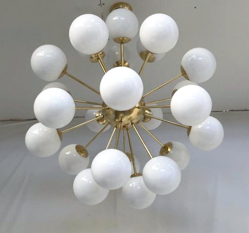 Italian sputnik chandelier with 24 Murano glass globes mounted on brass frame / designed by Fabio Bergomi for Fabio Ltd / Made in Italy
24 lights / E12 or E14 type / max 40W each
Measures: Diameter 35.5 inches, height 39.5 inches including rod and