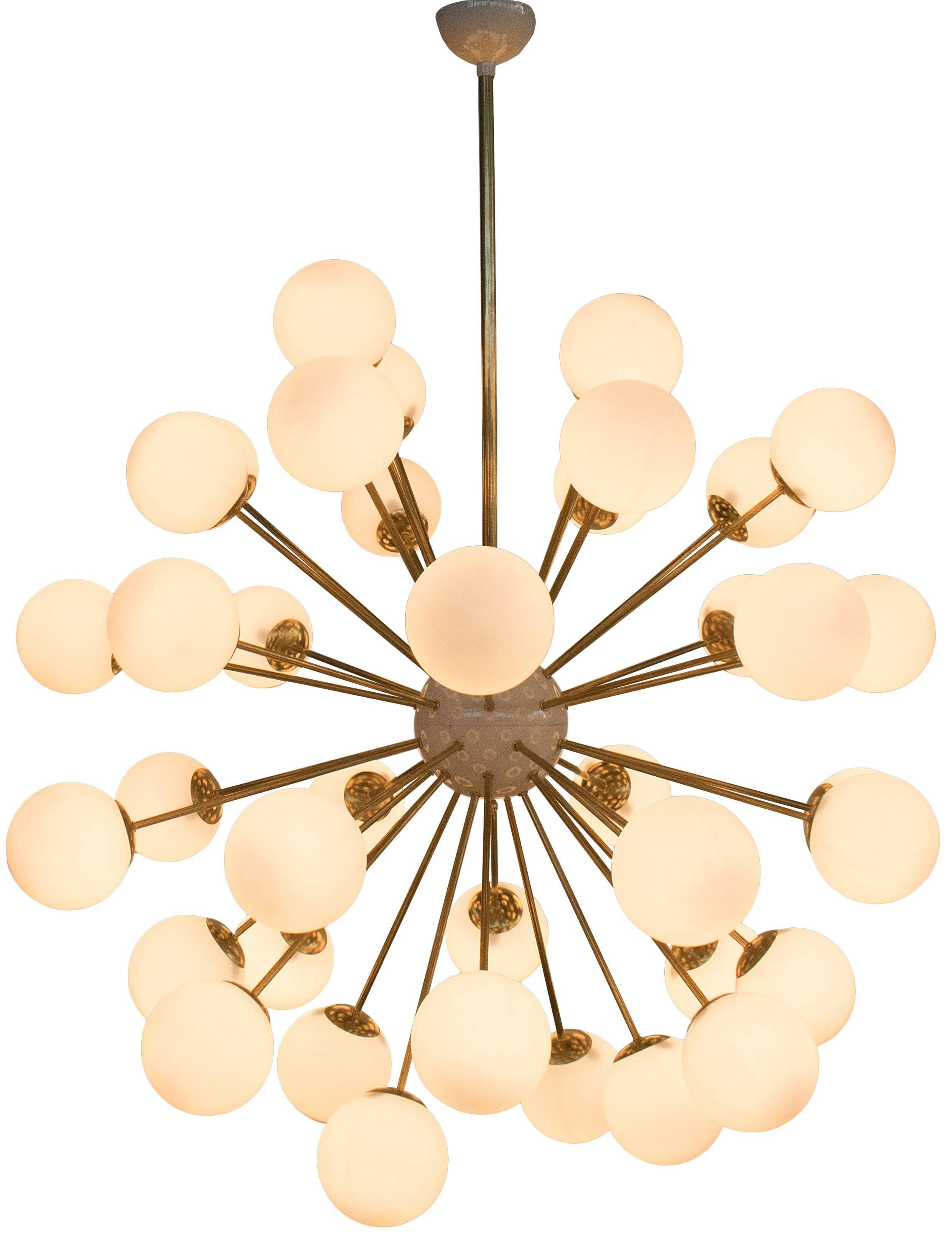 Italian sputnik chandelier with 40 Murano glass globes mounted on brass frame / Designed by Fabio Bergomi for Fabio Ltd / Made in Italy
40 lights / E12 or E14 type / max 40W each
Measures: diameter 49 inches / height 59 inches including rod and