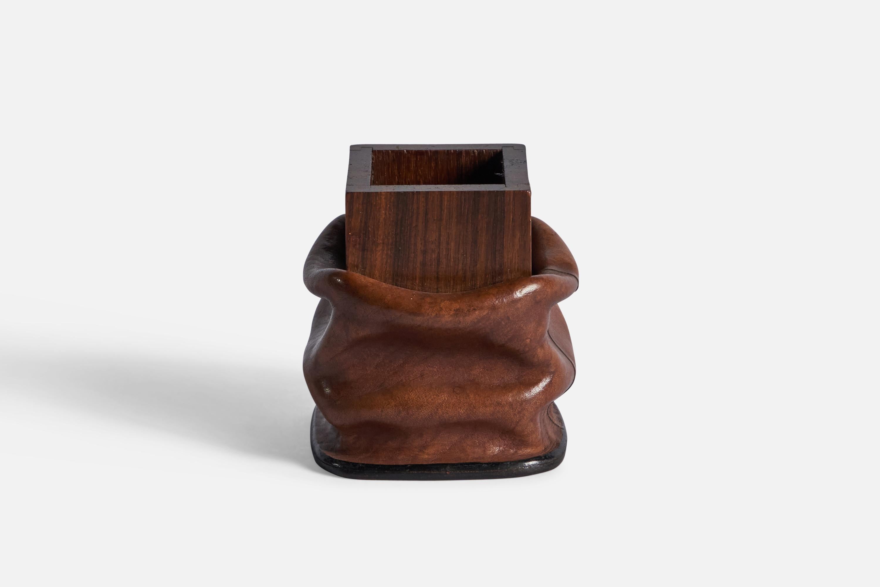 A wet-moulded leather and rosewood pen holder, designed and produced by Nova Tecno, Italy, c. 1960s.