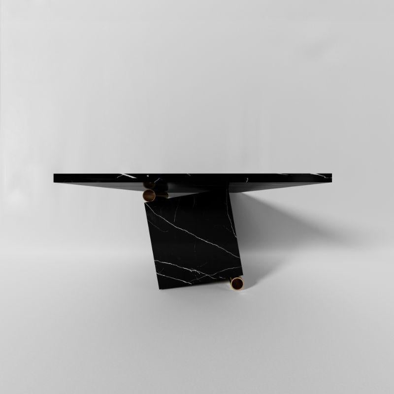 Nove table, Marquinia by Sissy Daniele
Dimensions: W220 x D110 x H75 cm
Materials: Marquinia, Bronze

Also available: Fumigated wooden case packing,

A marble block that rolls, stopped by a brass tube and a marble top that dynamically poses a