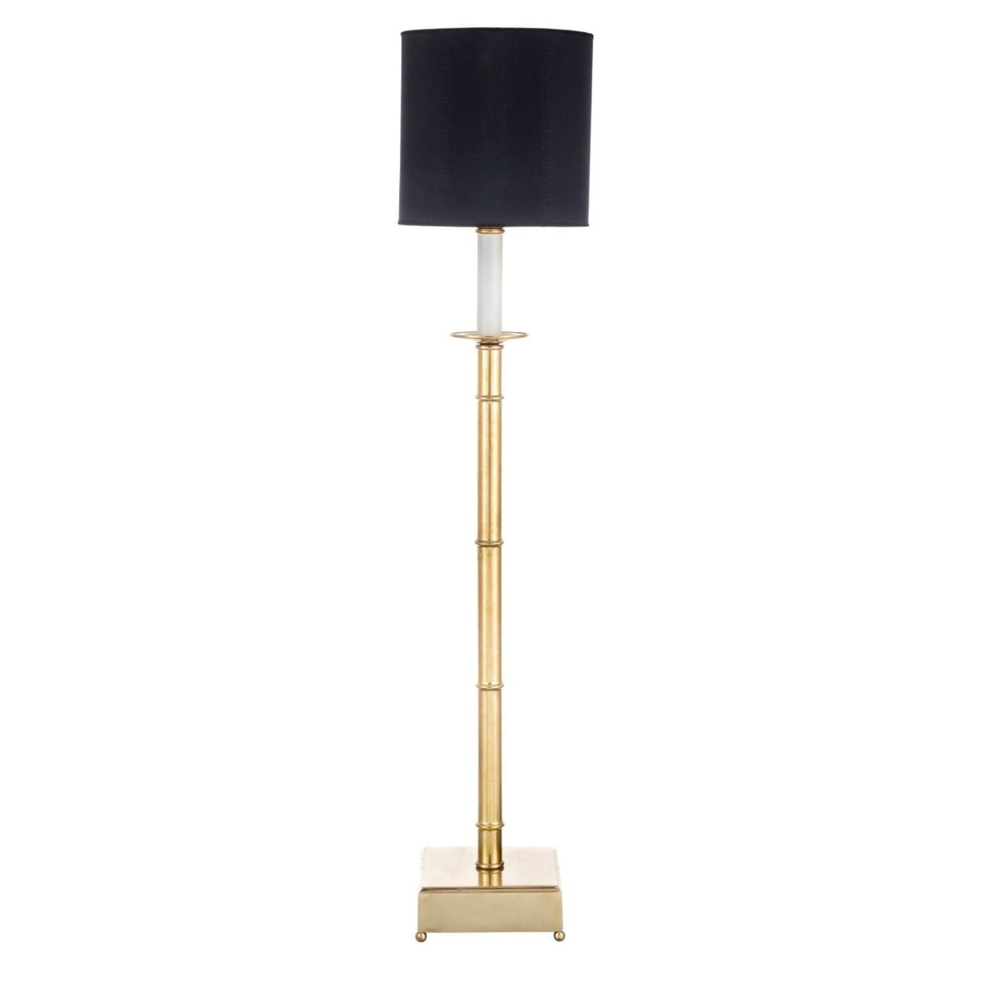 Enhance your living space with Novecento exquisite lamp featuring a stunning natural brass bamboo shaped structure, complemented by a sleek black fabric lampshade. This contemporary design effortlessly combines elegance and functionality, providing