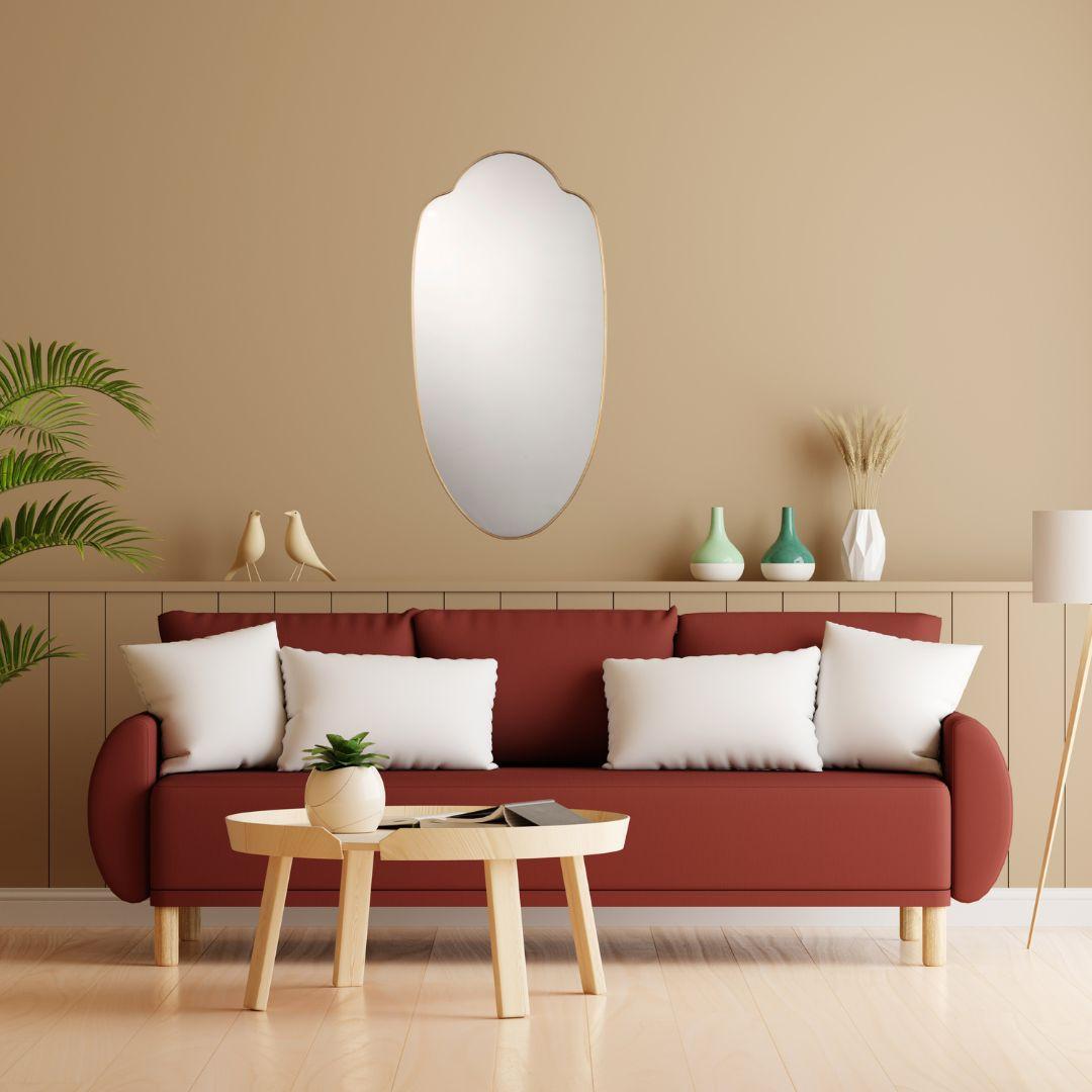 Large mirror with a very sinuous shape and a vintage flavor, it reminds the mirrors of the great italian country houses of the past, those of the master bedrooms with an elegant but a little run-down atmosphere, terracotta floors, wrought iron beds