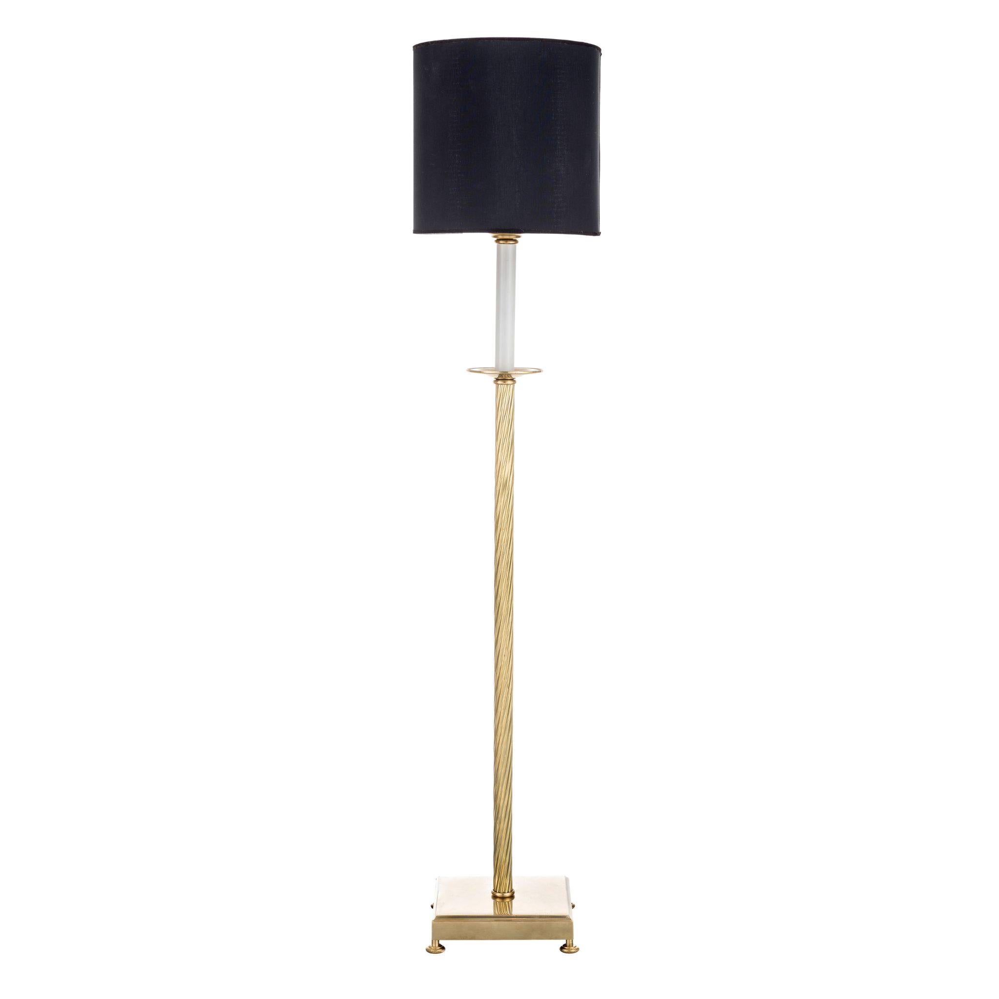 Enhance your living space with Novecento exquisite lamp featuring a stunning natural brass shaped structure, complemented by a sleek black fabric lampshade. This contemporary design effortlessly combines elegance and functionality, providing a warm