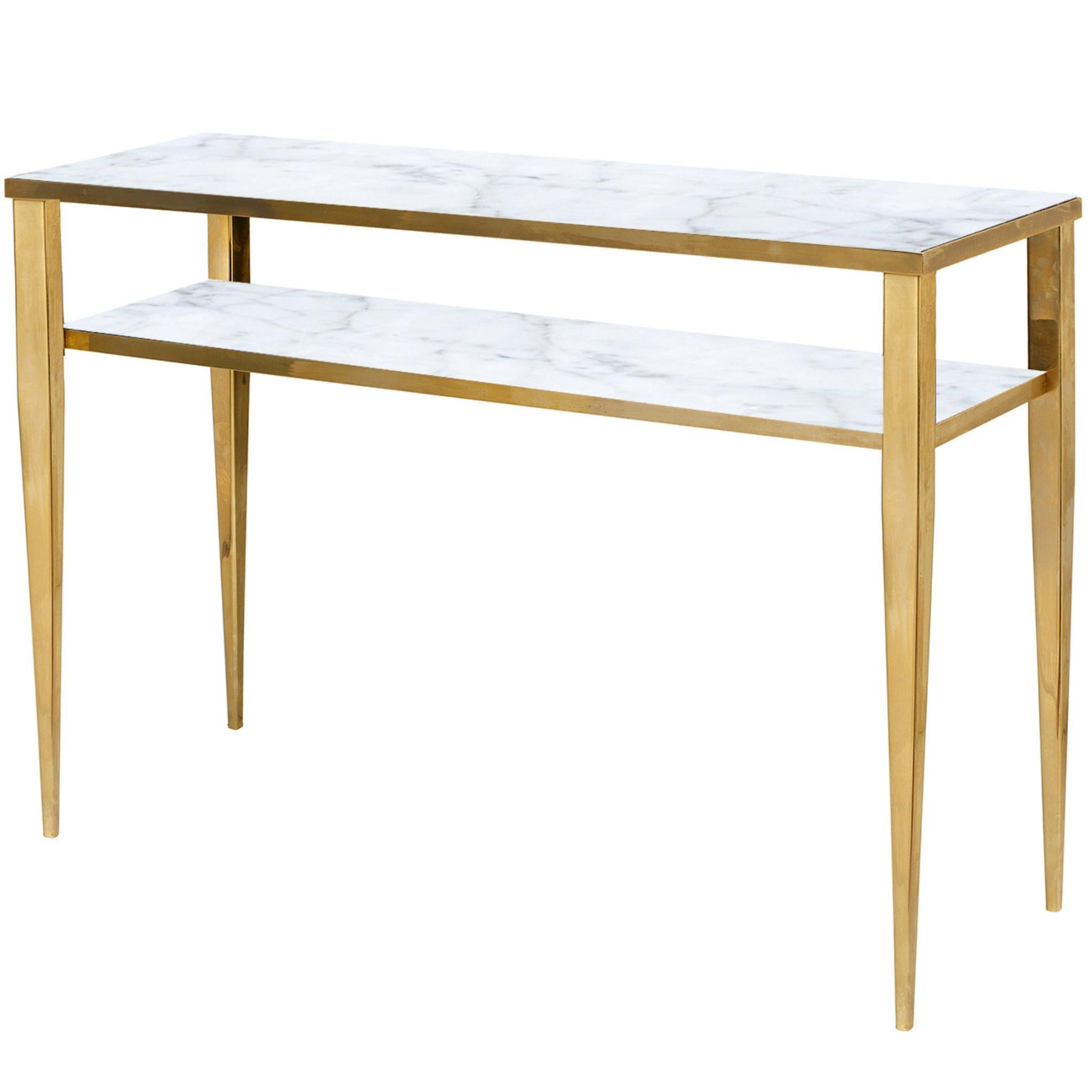 Fine and elegant, this console has a slender silhouette in brass and a double marble shelf, it belongs to the Novecento line characterized by a retro taste that refers to atmospheres of the early years of this century, in particular the design of