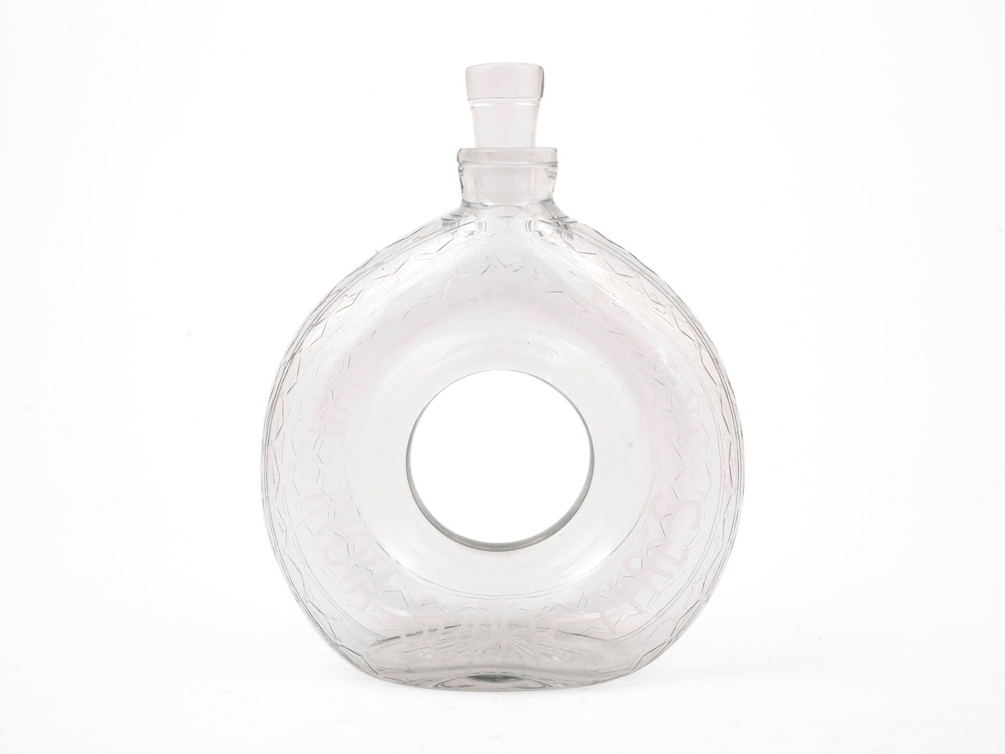 Dating to the Art Deco Period

From our Decanter collection, we are pleased to offer this Rare Novelty Glass Tyre Decanter. The decanter of oval shape with a central hole formed in glass with a glass stopper. The decanter modelled as a tyre used as