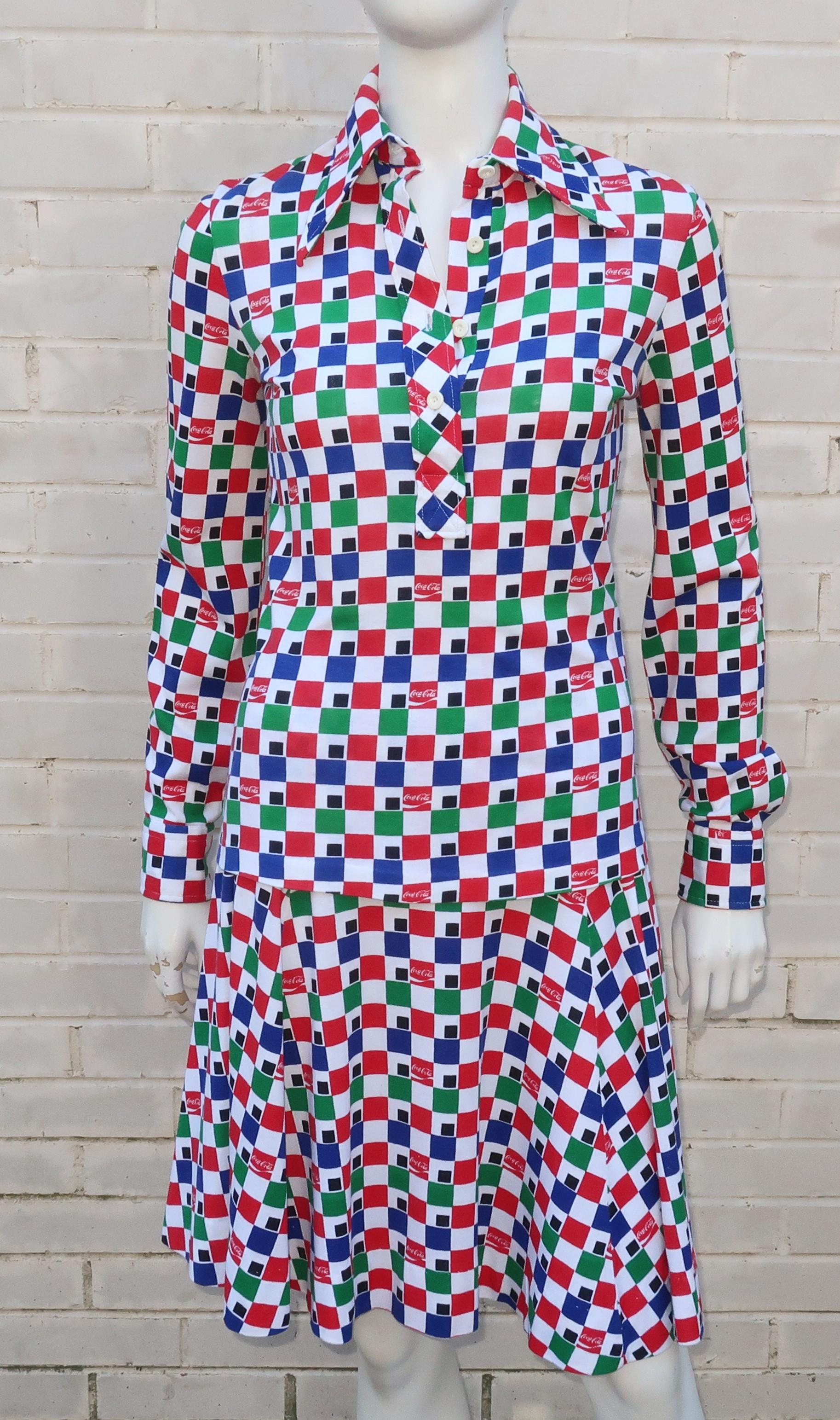 A fun 1970's two piece jersey dress in a vibrant combination of red, green, blue, white and black check pattern with a surprise 'Coca-Cola' logo designed into the print.  Made in Italy by Eva for Robert Janan and similar in weight and style to the