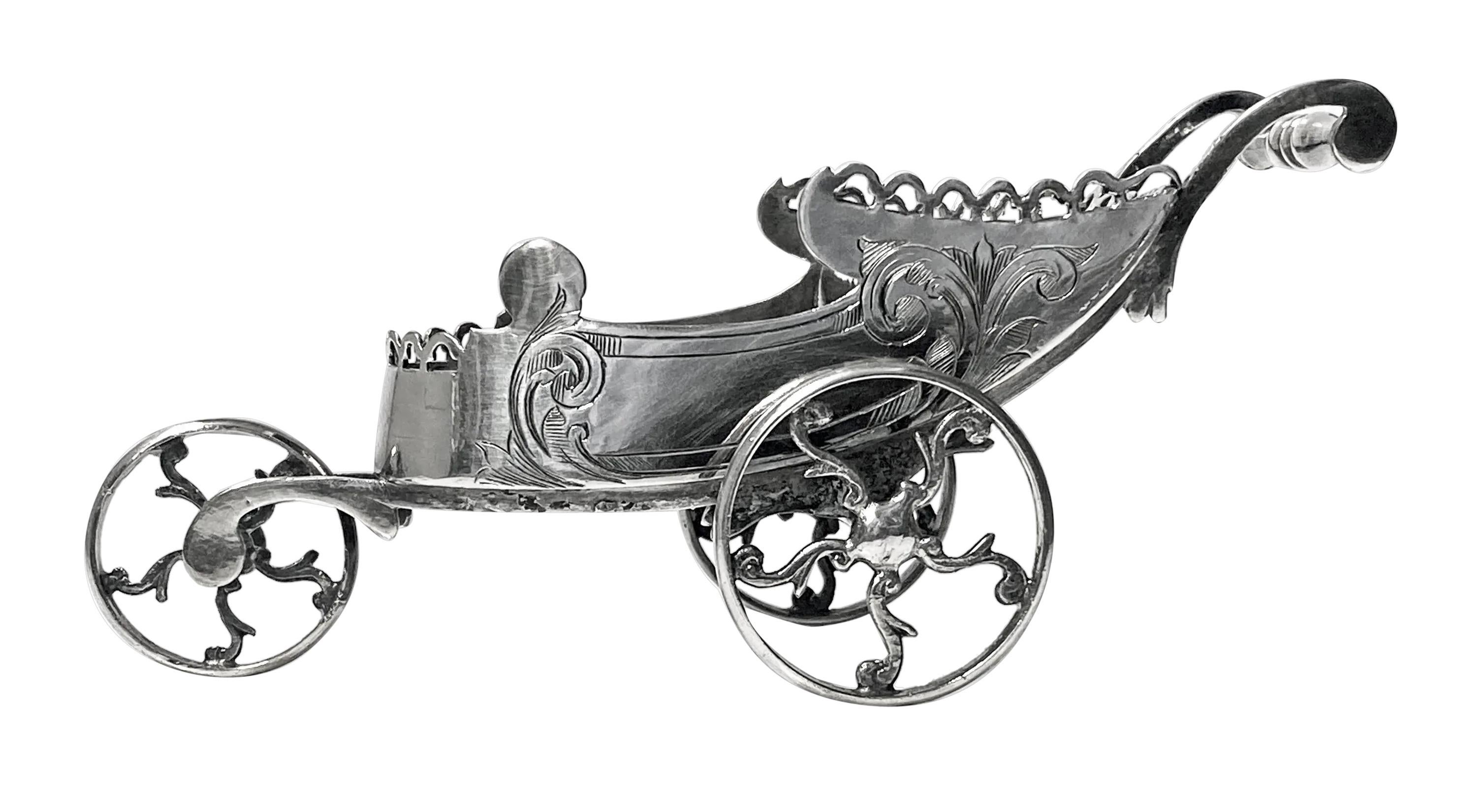 Novelty silver plate Chariot Carriage Continental C.1870. Together with associated spoon could be used for Condiments or small mints etc. Very intricately made with pierced frieze surround and hand engraved decoration. Measures: 6.00 x 2.50 x 2.25