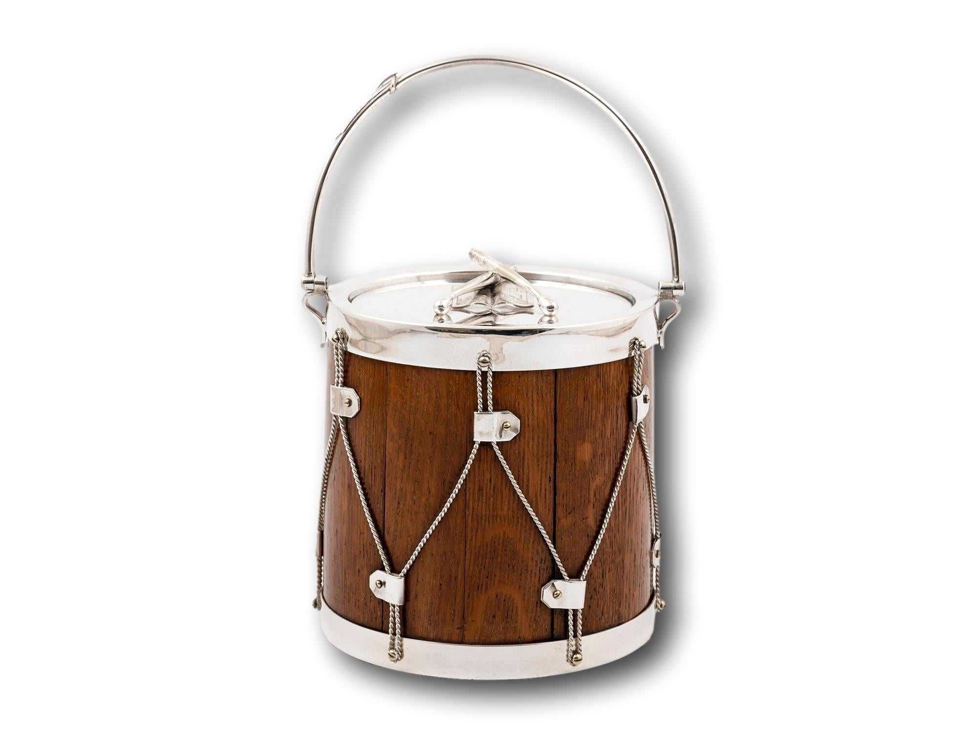 In the Form of a Drum 

From our Accessories collection, we are pleased to offer this Novelty Silver Plate Military Drum Biscuit Barrel. The Biscuit Barrel of novelty form in the shape of a antique military drum with an Oak shell,  silver plate