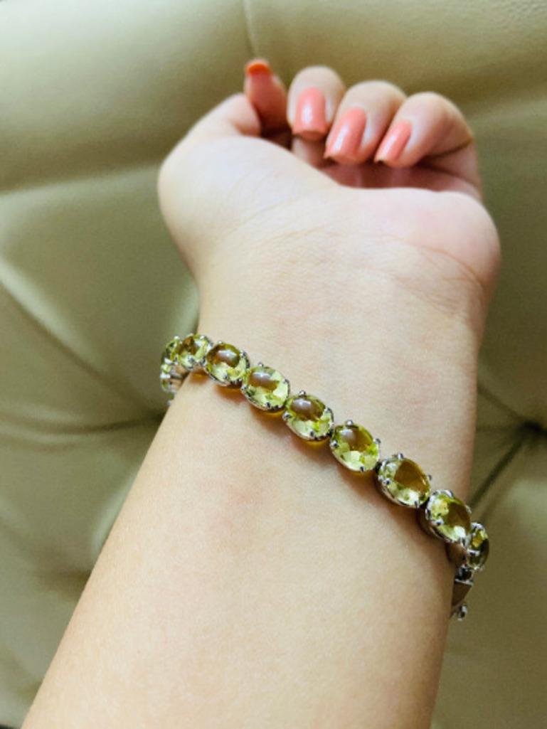 Beautifully handcrafted silver November Birthstone Lemon Topaz Tennis Bracelet, designed with love, including handpicked luxury gemstones for each designer piece. Grab the spotlight with this exquisitely crafted piece. Inlaid with natural lemon