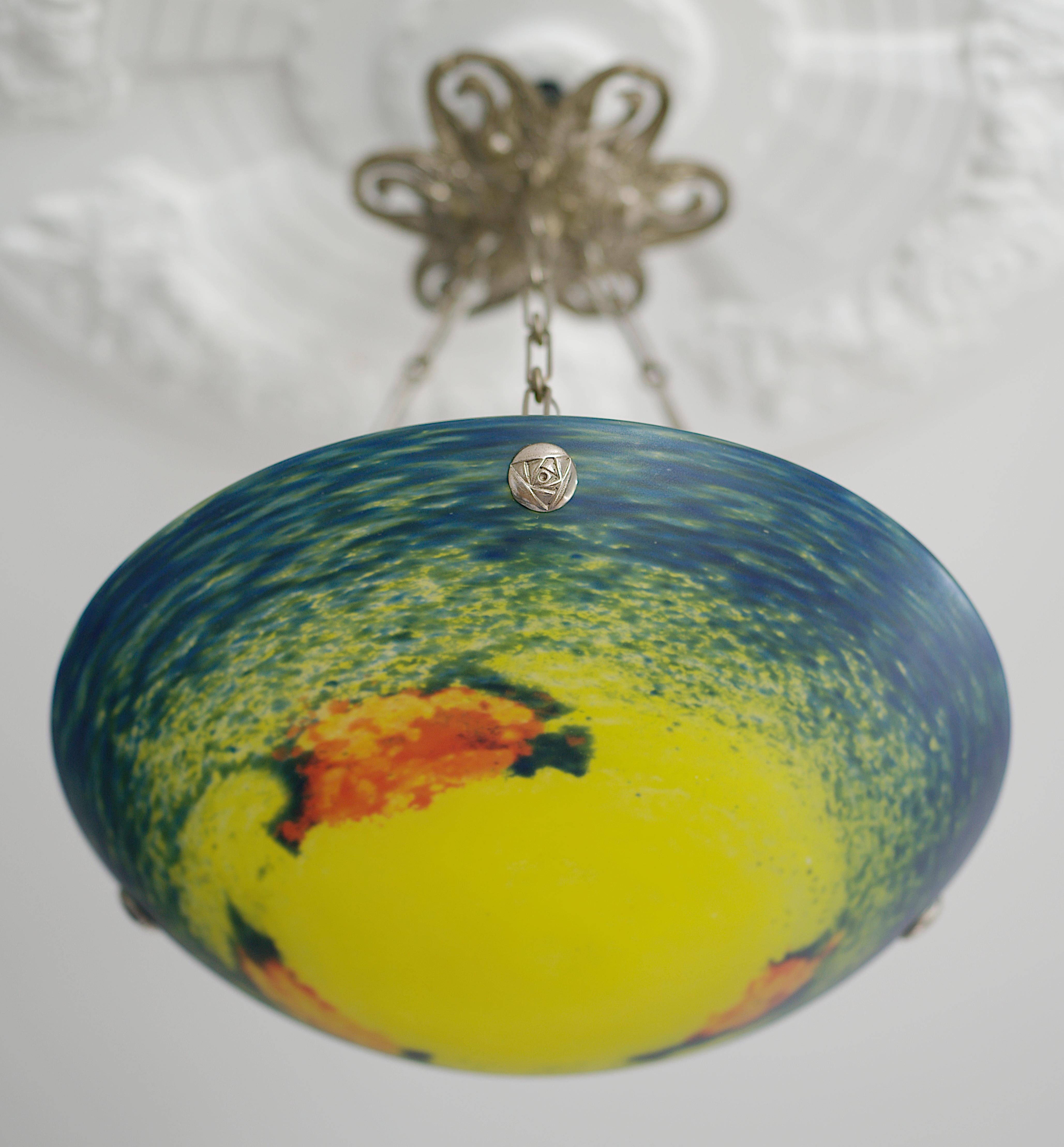 French Art Deco pendant by Jean NOVERDY, Dijon, France, 1920s. Mottled glass shade, powders are applied between two layers that comes hung at its beautiful full bronze fixture. Stunning canopy with swans. Height : 17.3