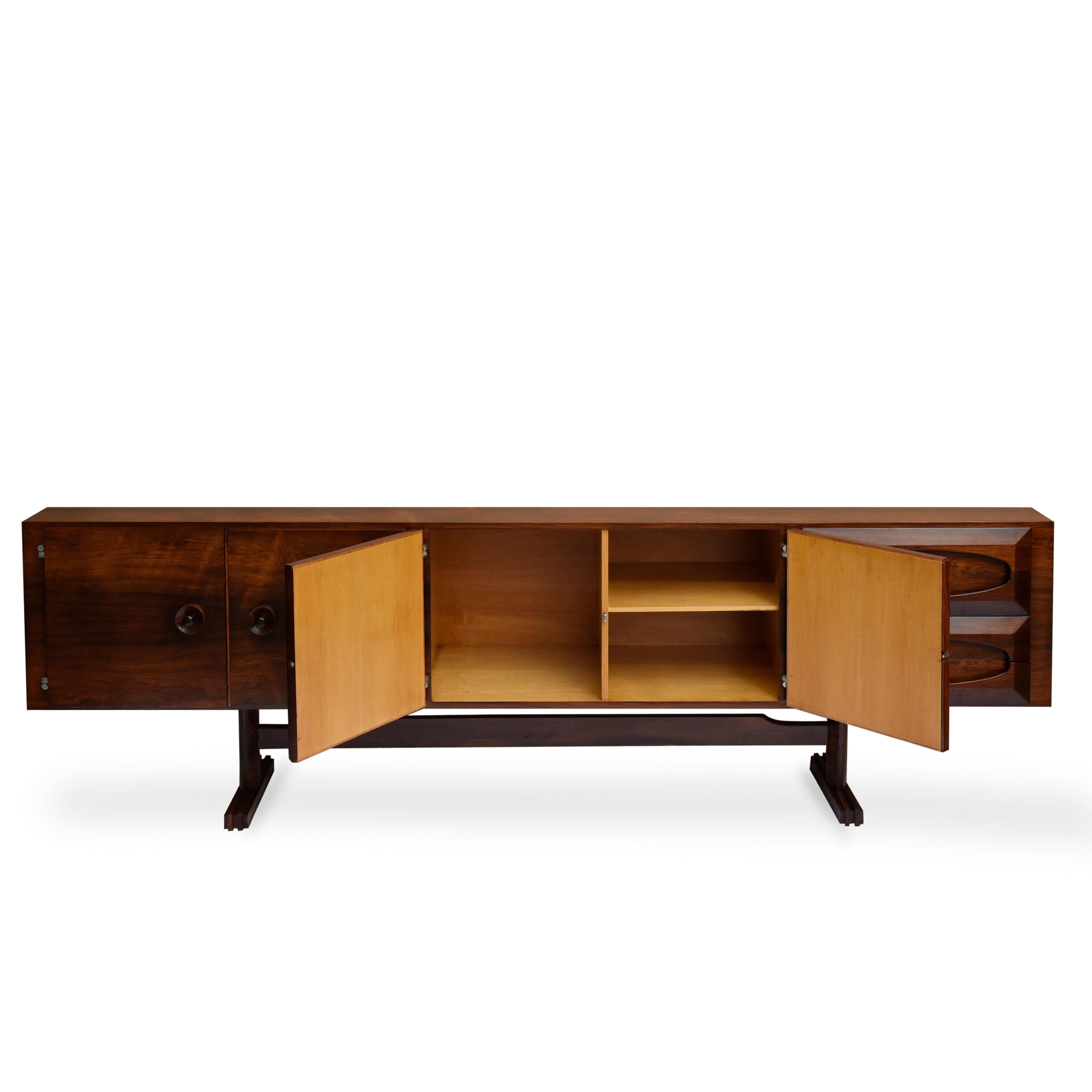 Novo Rumo midcentury Brazilian buffet with brazilian wood structure, 1960s

Beautiful buffet with four doors and four drawers.
There are 6 compartments behind the doors with ample storage. The detail of the drawer knobs is the highlight of the